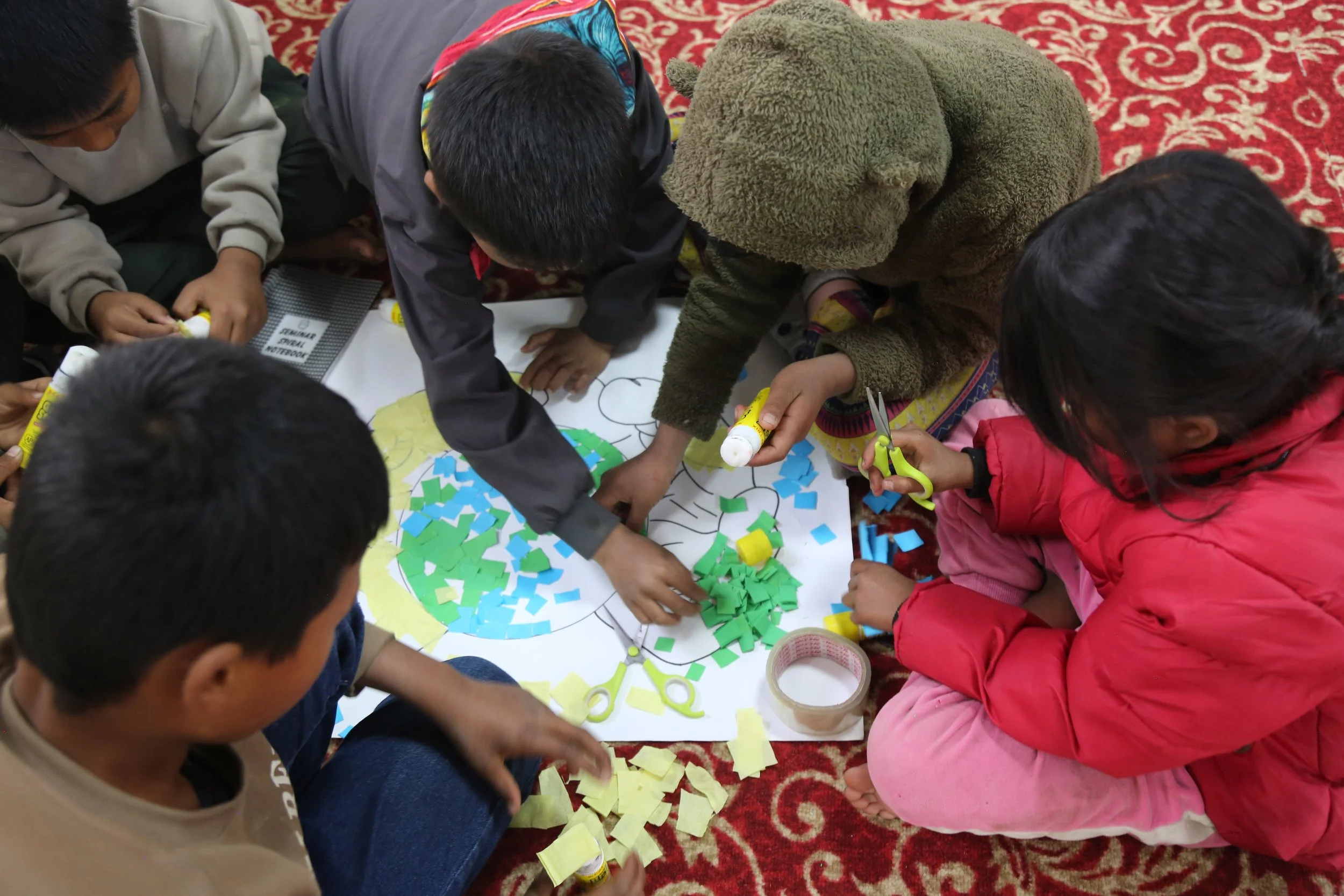 Children creating a collage (thanks to CarNetNepal)
