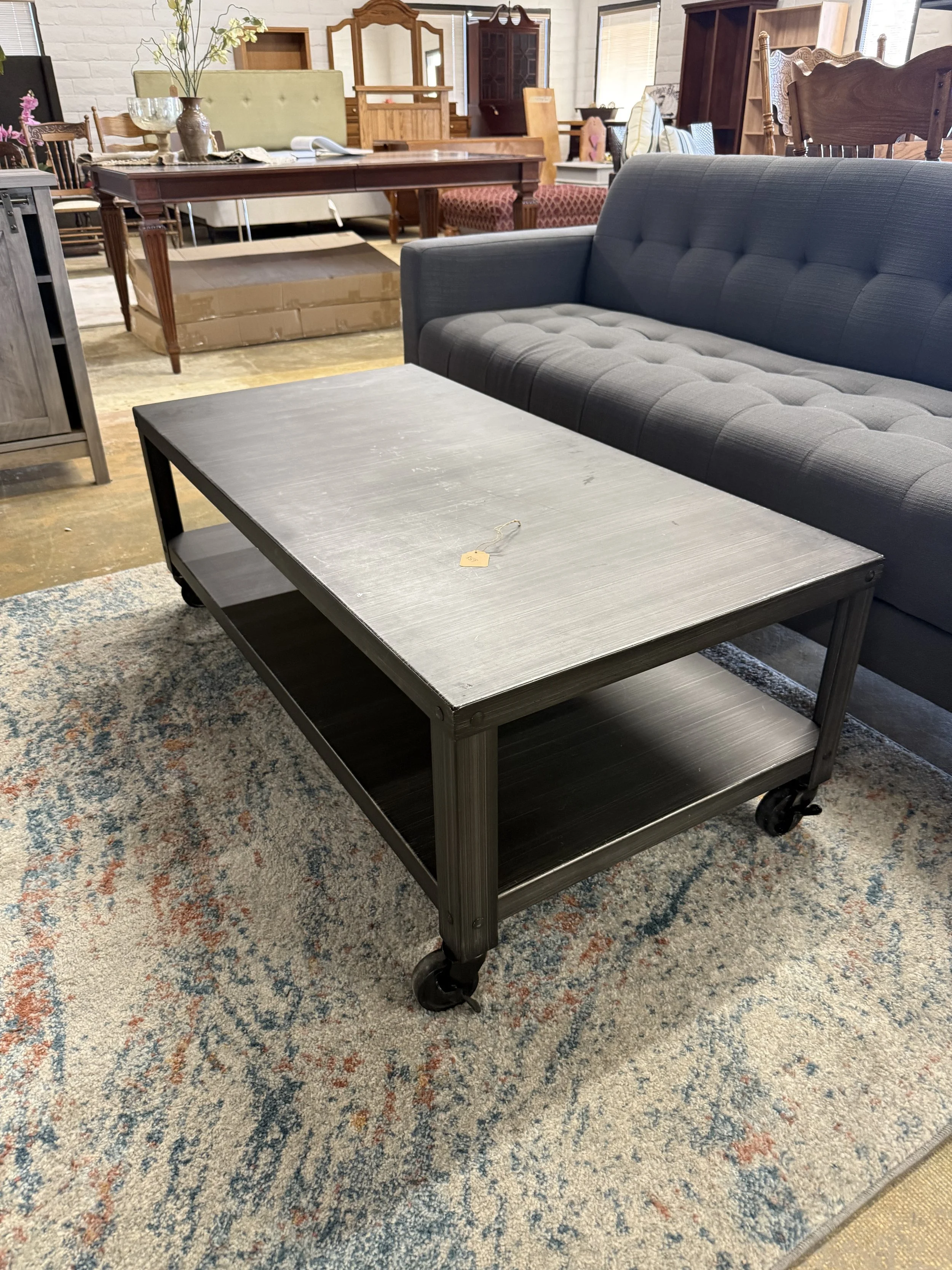 Industrial style metal coffee table on wheels: $49