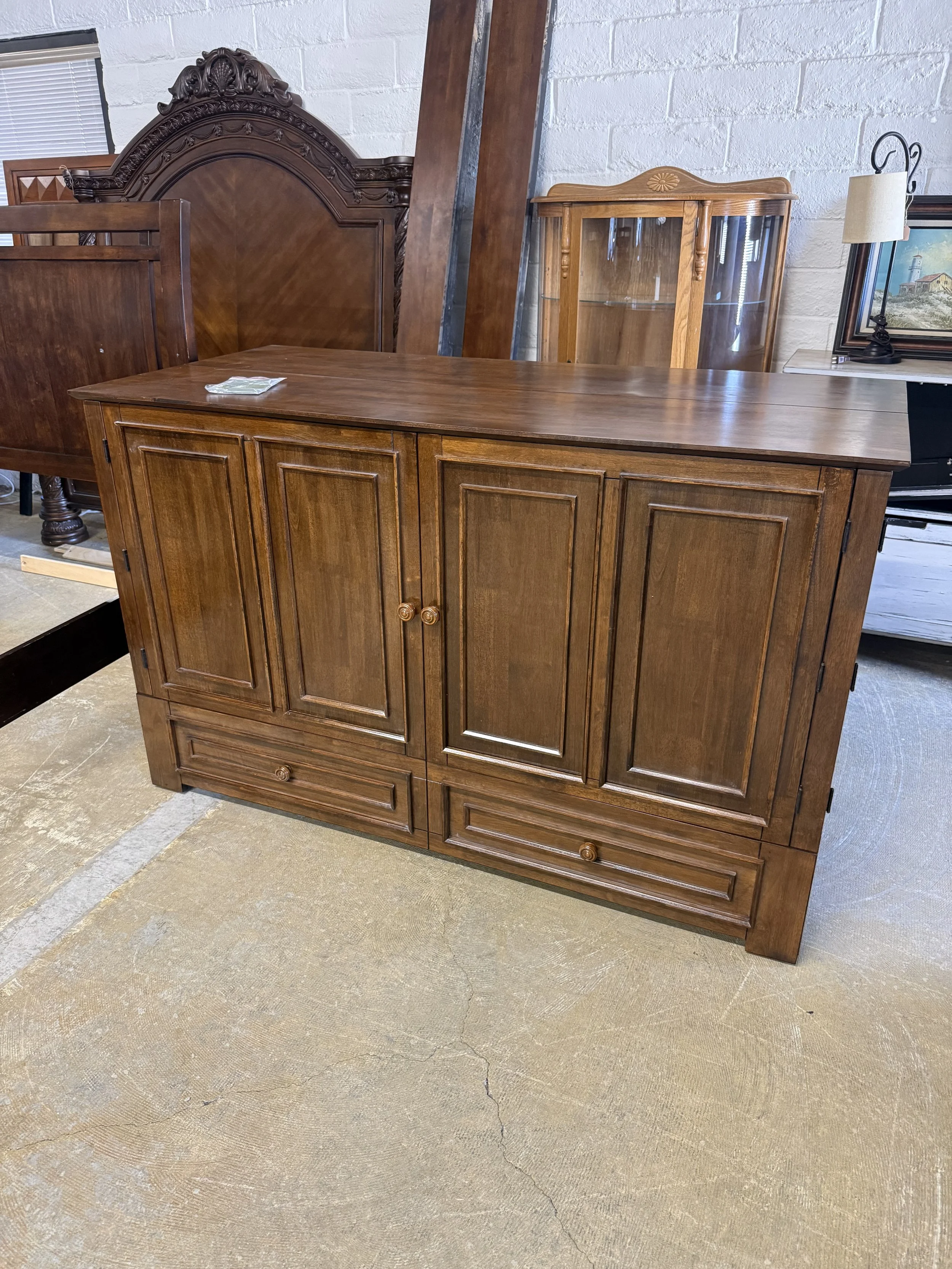 McCutchen Solid Wood Queen Murphy Storage Bed: $999