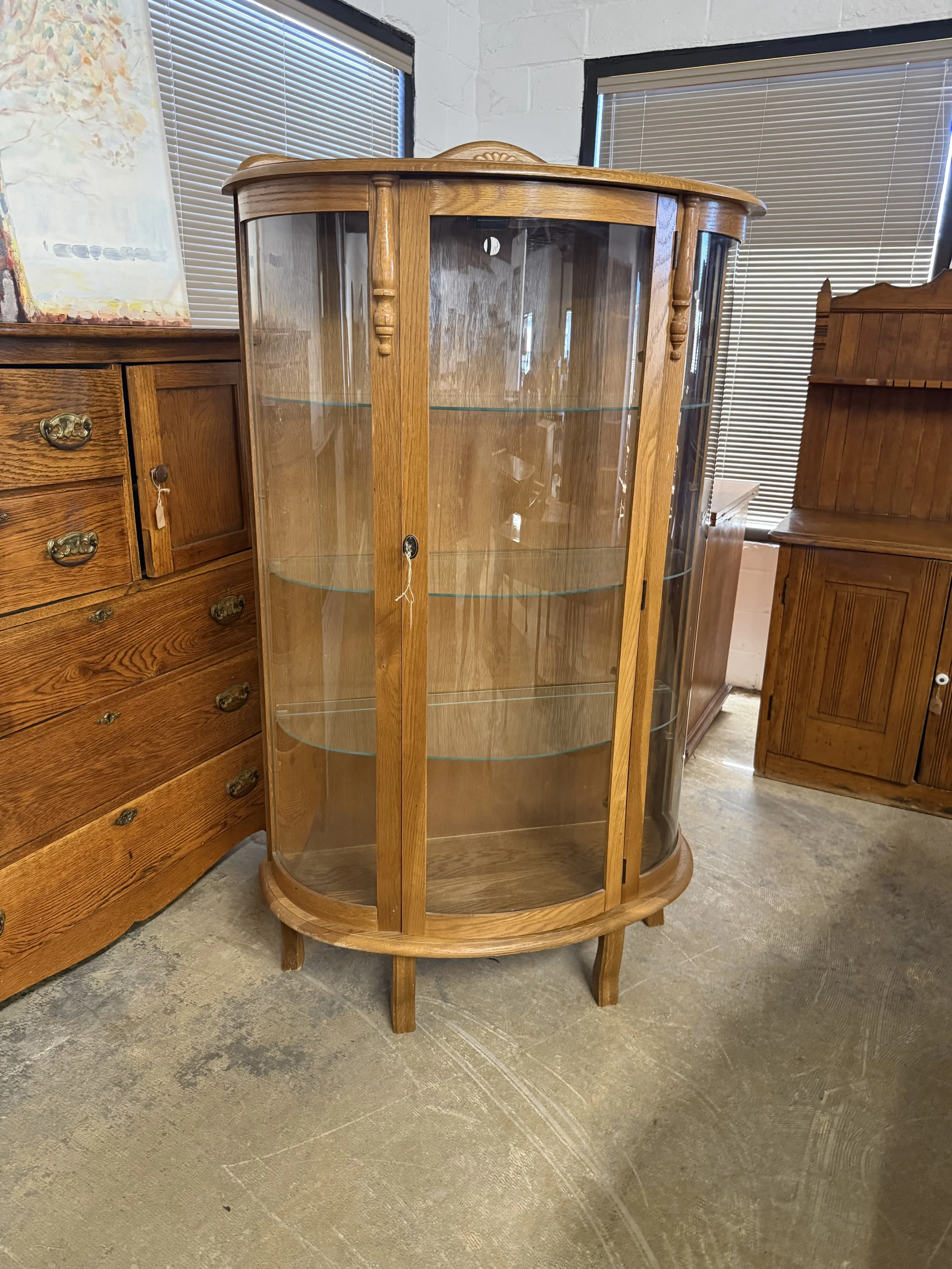 Bowed Glass Curio Cabinet with Glass Shelves: $199