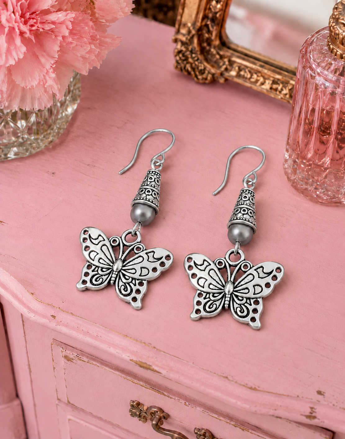 Butterfly Earrings Gray Accent Pink Dresser 1 ChatGPT.png