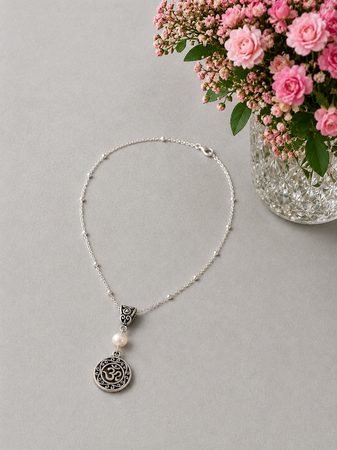 Om Pearl Necklace Flowers ChatGPT.png