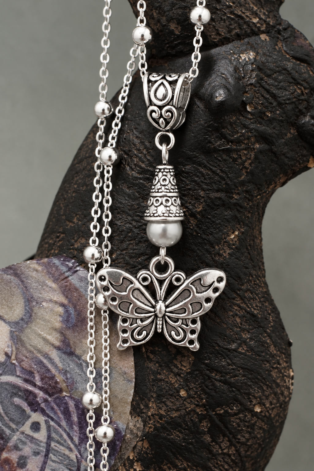 Butterfly Necklace Gray Accent Bird ChatGPT.png