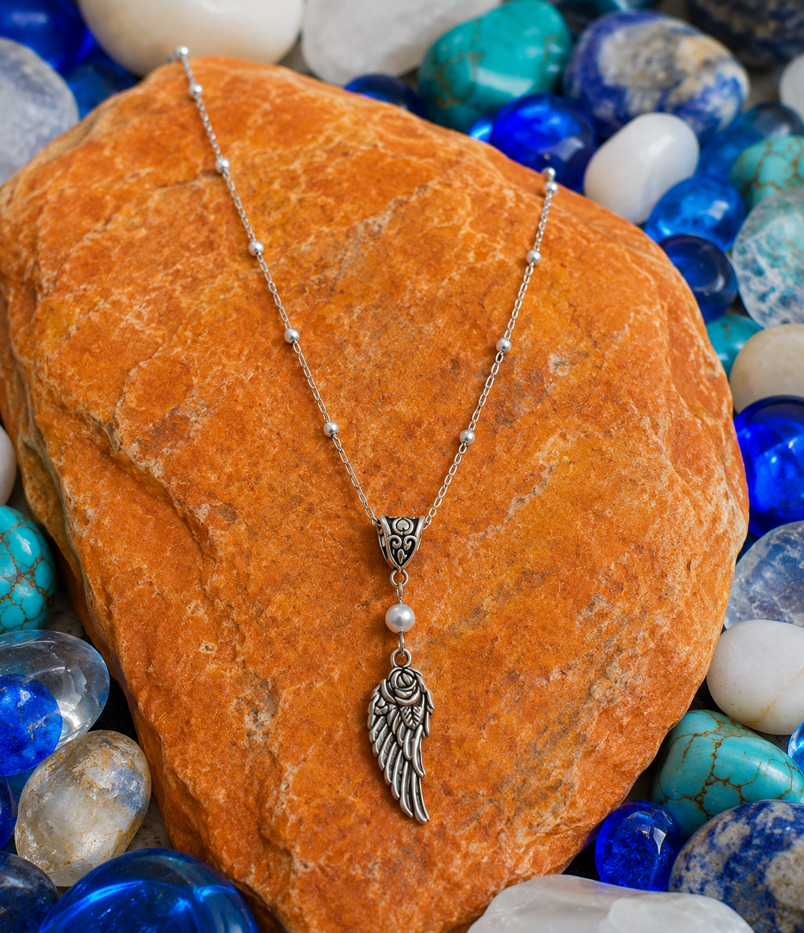 Wing Pearl Necklace Stones ChatGPT.png