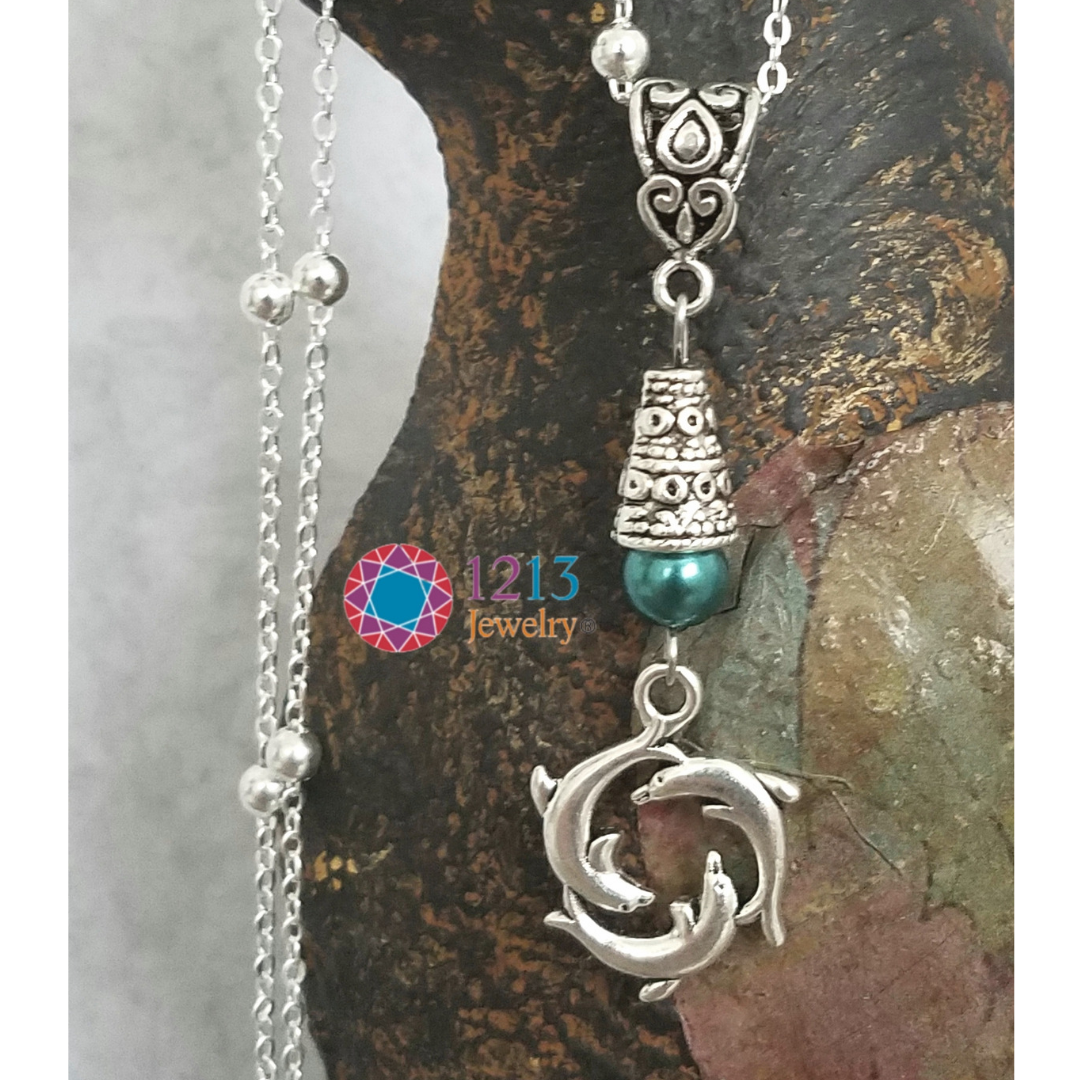 Dolphin Necklace Logo Close.png