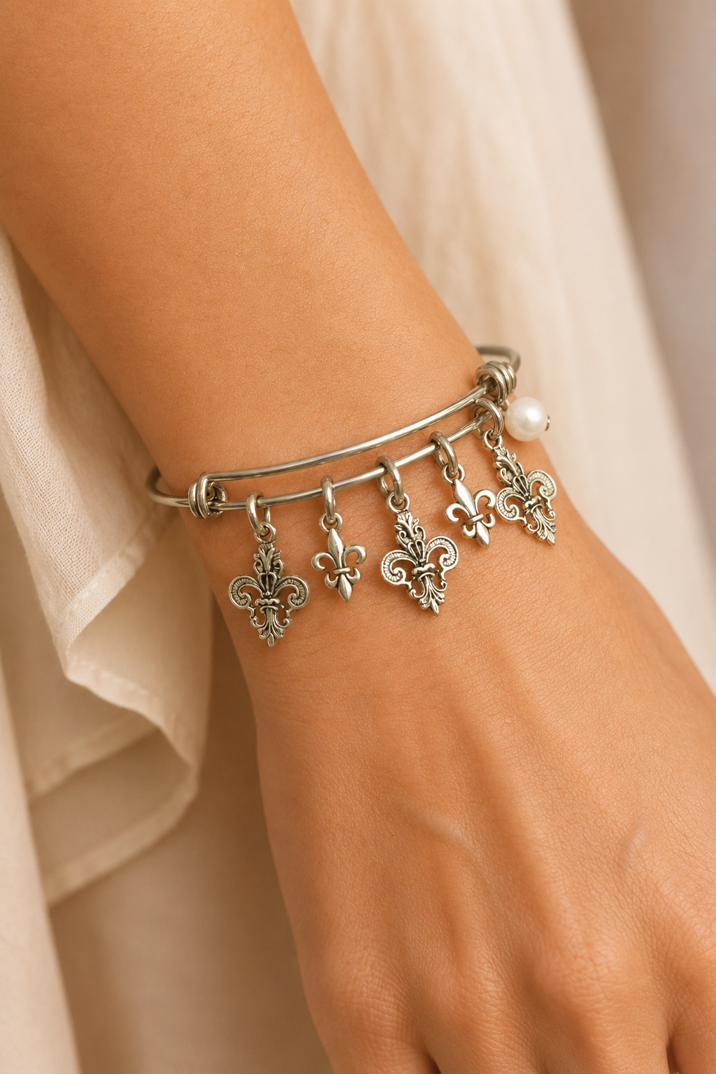 Fleur De Lis Pearl Bracelet Model Cream Dress ChatGPT.png