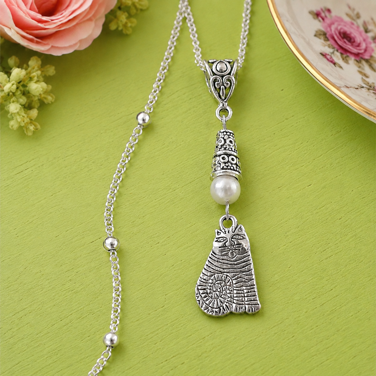 Cat Necklace White Table ChatGPT.png