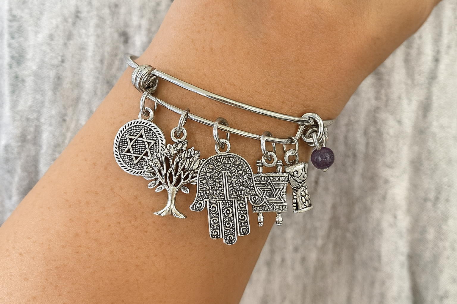 Jewish Amethyst Charm Bracelet Model ChatGPT.png
