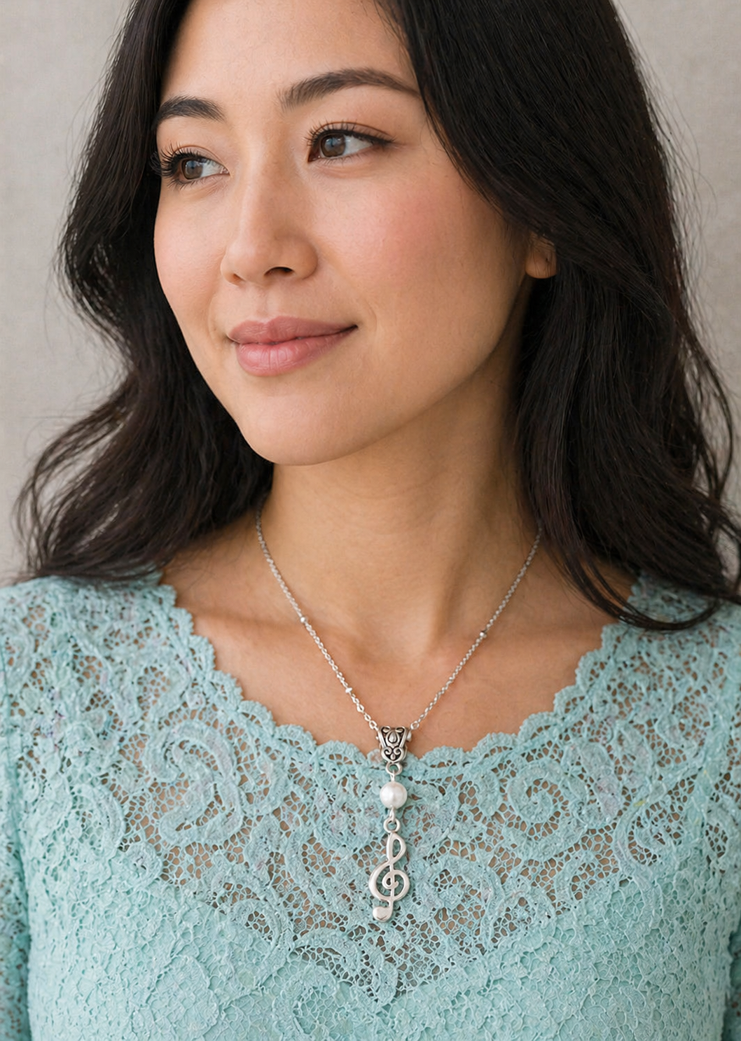 G Clef Pearl Necklace Close Model ChatGPT.png