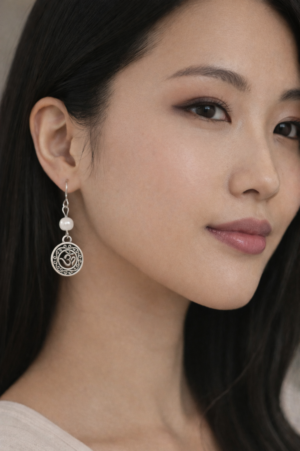Om Pearl Earrings Model ChatGPT.png