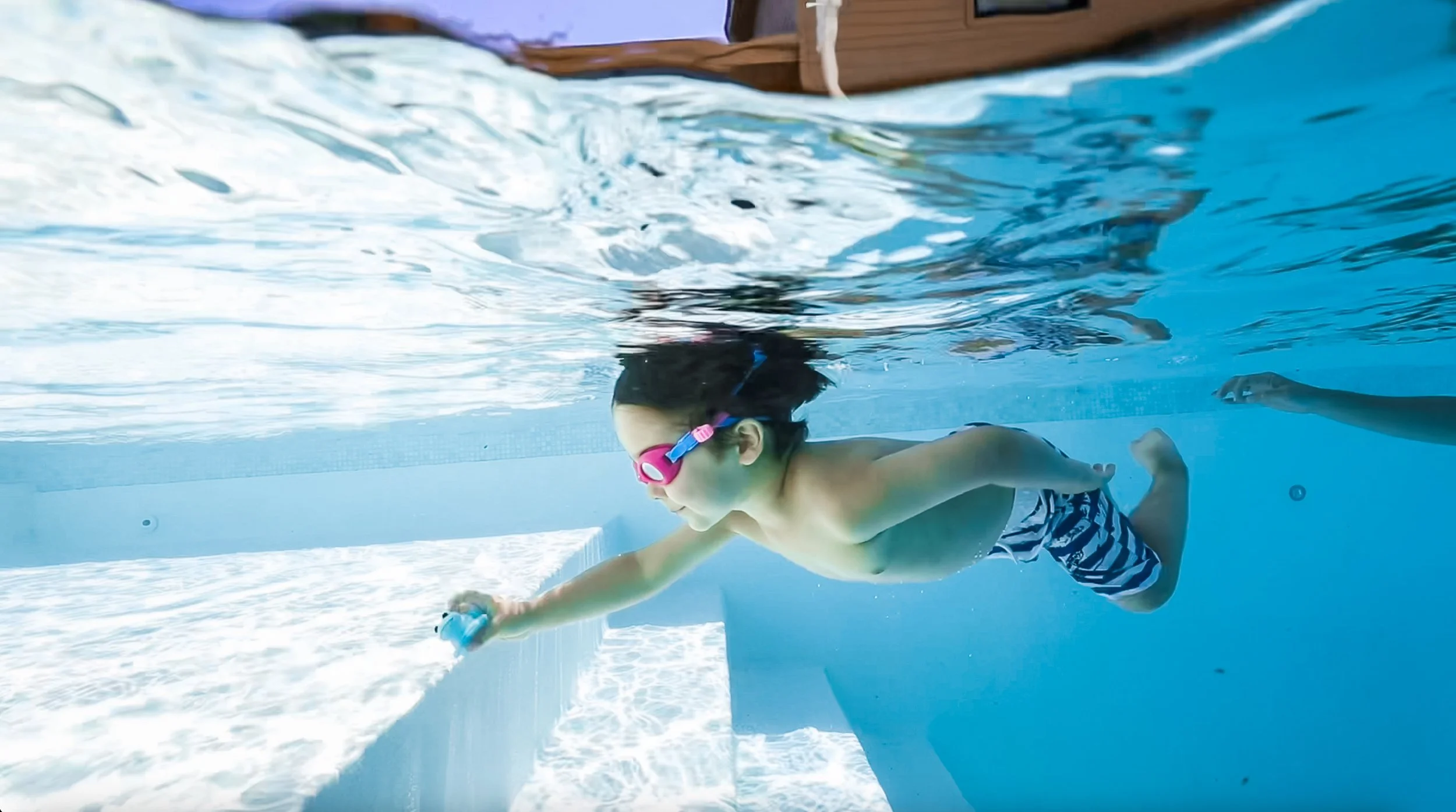 K&K Swim School Kid Swimming Underwater