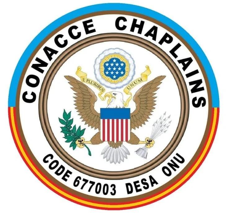 Emblem of Conage Charlains featuring an American eagle with a shield, holding an olive branch and arrows, surrounded by the text 'CONAGE CHALAINS,' 'CODE 677003,' and 'DESA ONU,' with a circular border and a blue, red, and yellow edge.