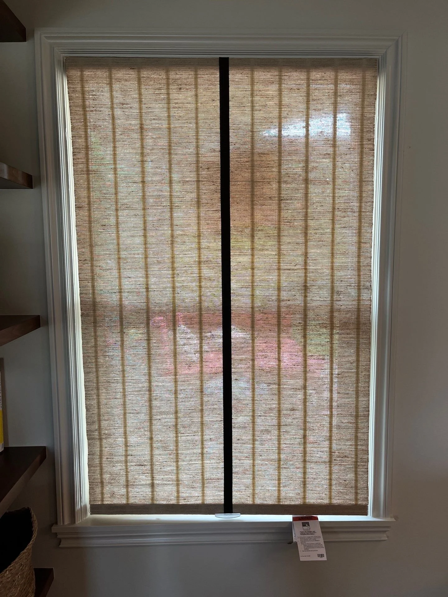 Woven grass shade with handsewn tape trim from LP Studio in Woodinville, WA