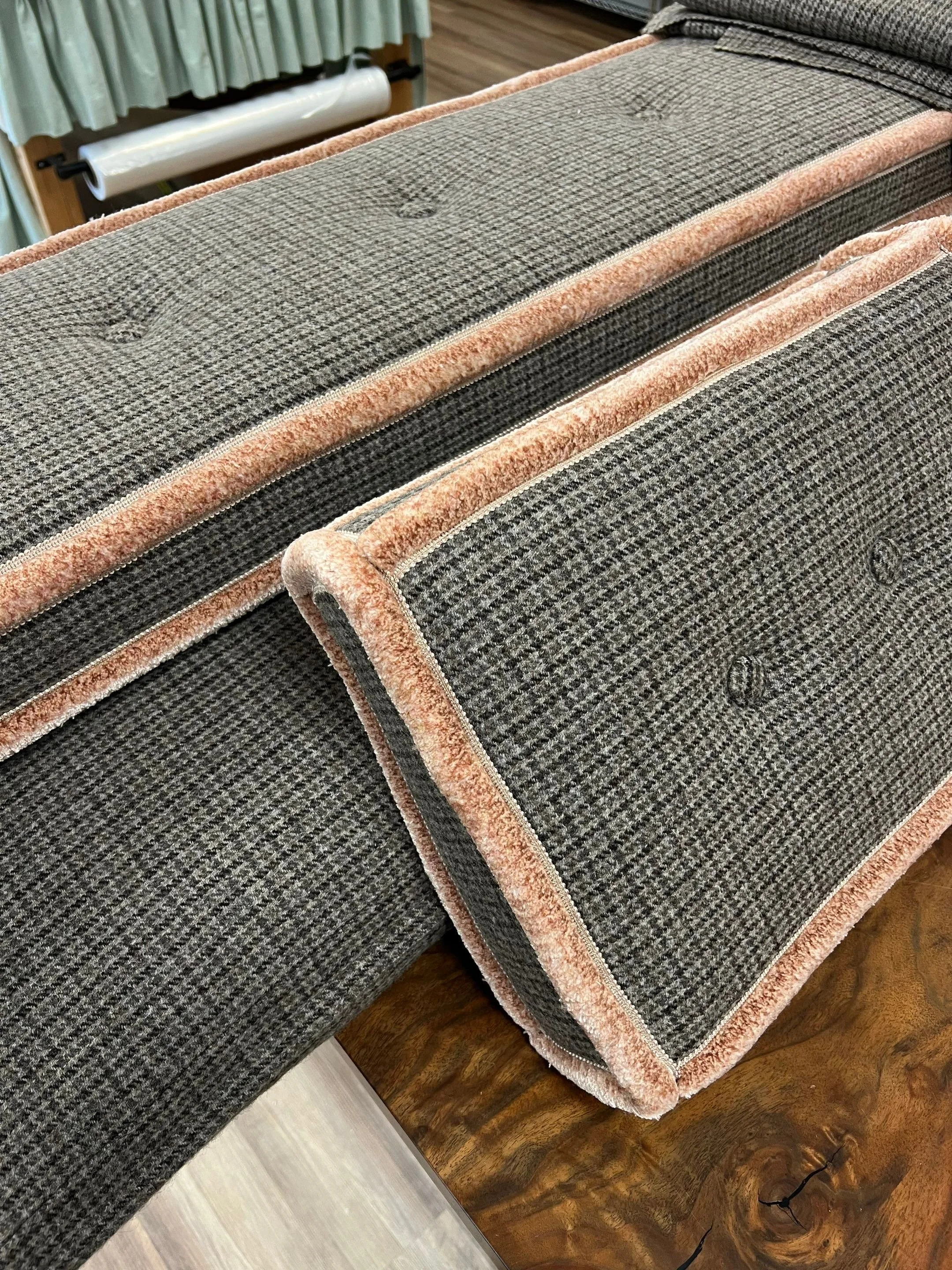 Button tufts and contrast trim on a cushion from LP Studio Workroom in Woodinville, WA