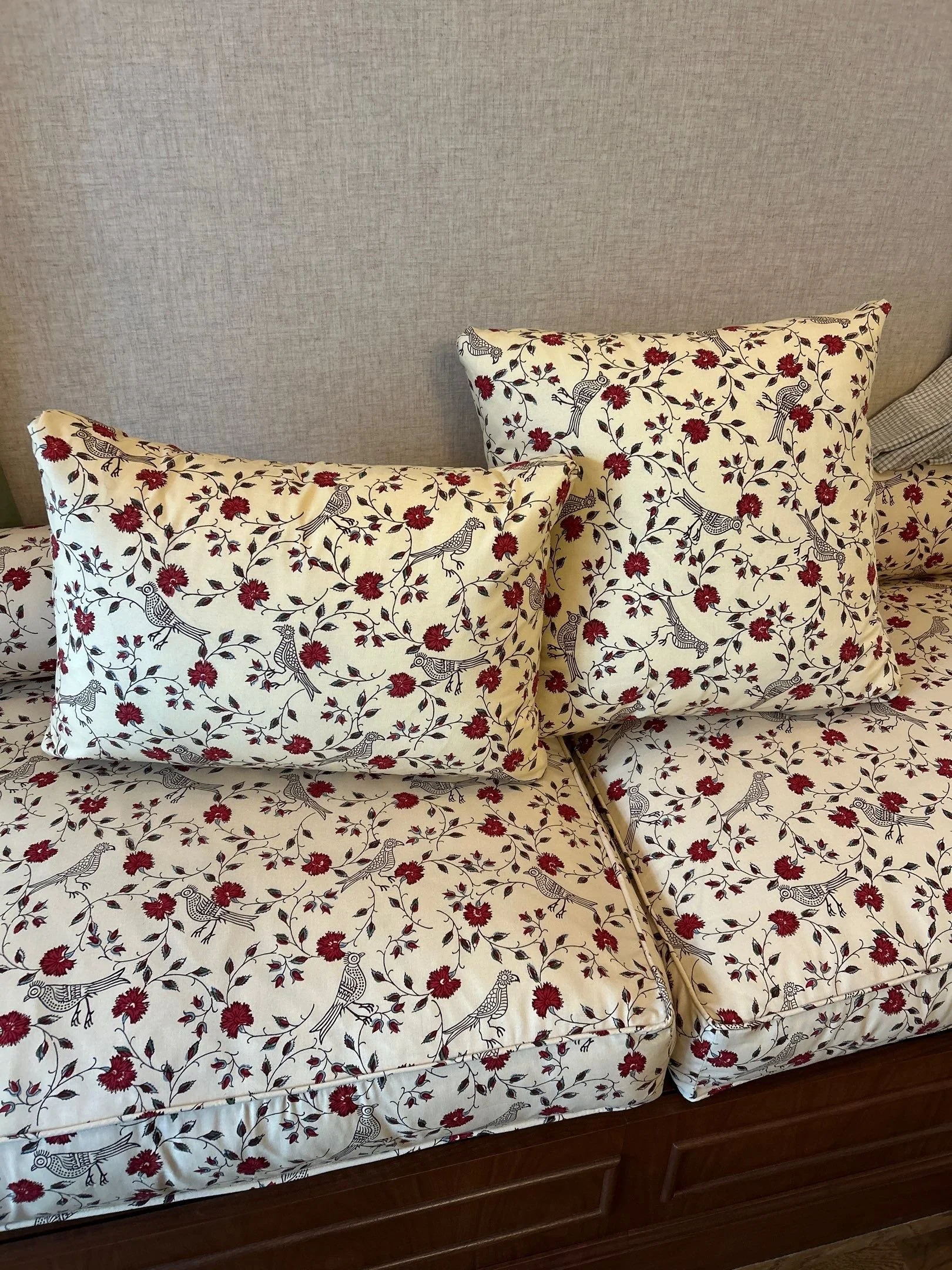 Down-wrapped cushion with welt trim on box edge from LP Studio workroom in Seattle