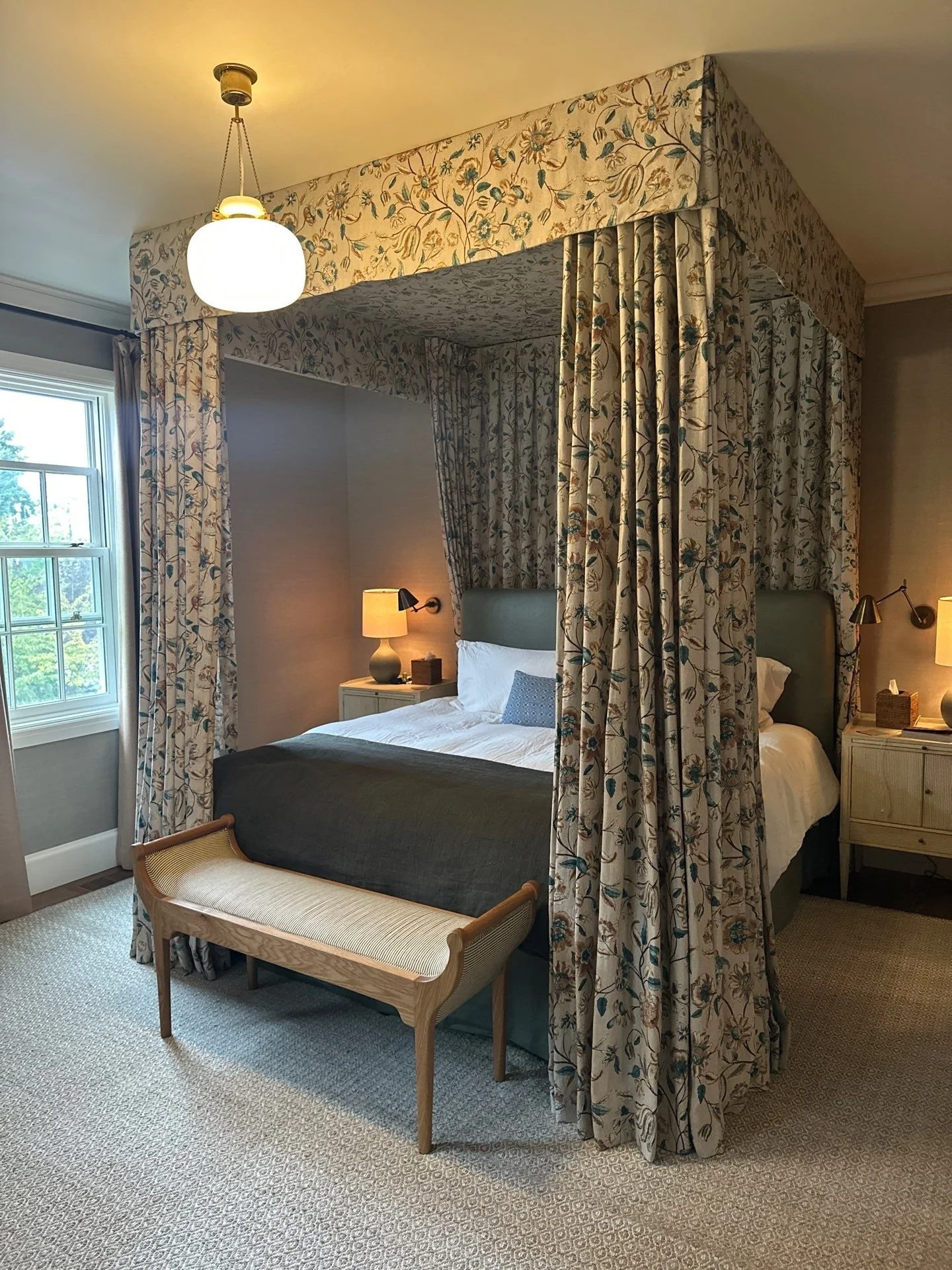 Four-post bed with full drapery and valance at the top