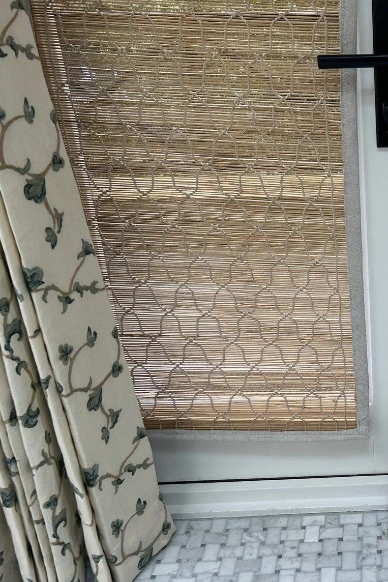 Woven grass shade with detail trim from LP Studio in Woodinville, WA