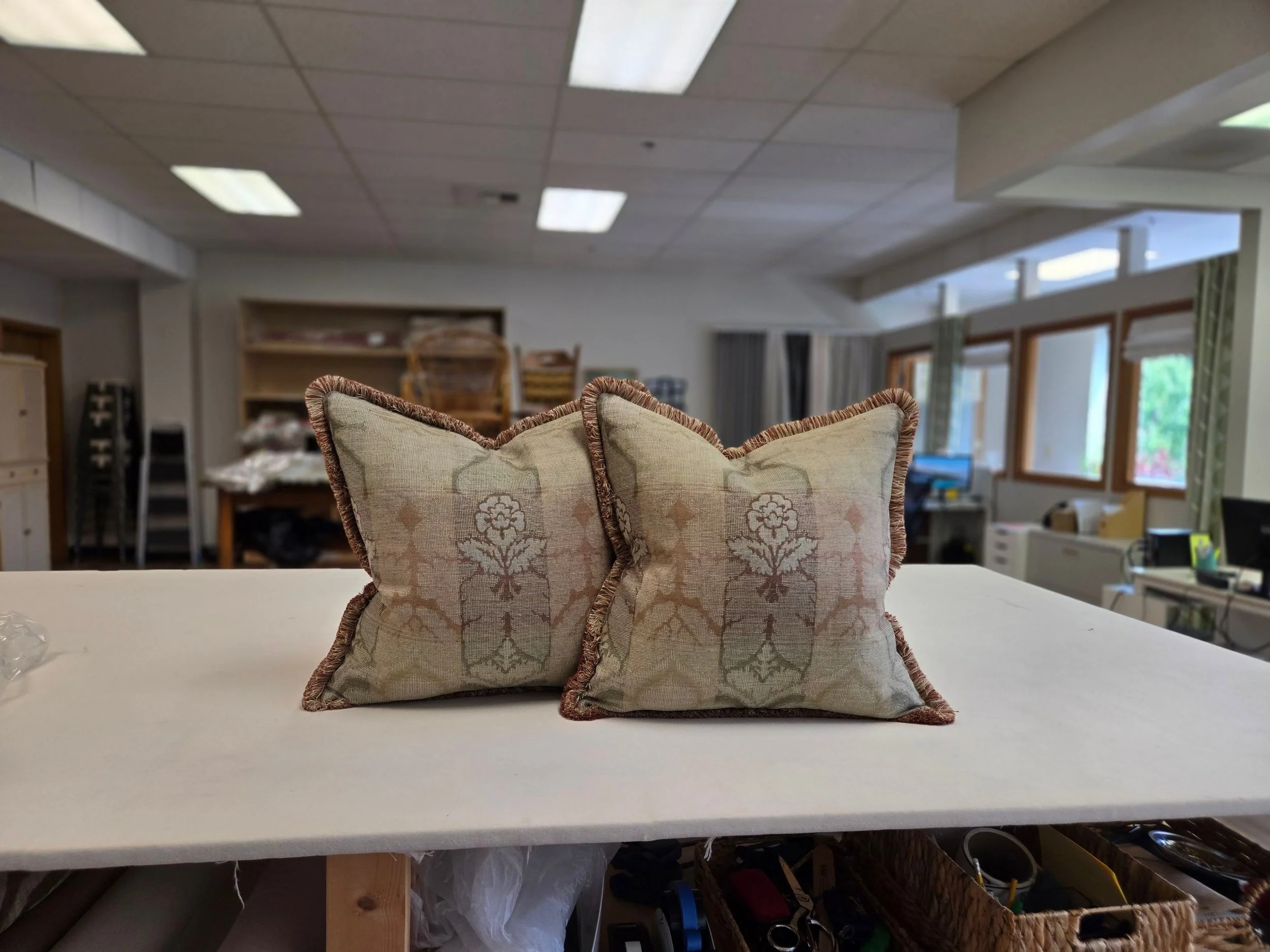 Pillow with fringe trim on box from LP Studio workroom in Woodinville, WA