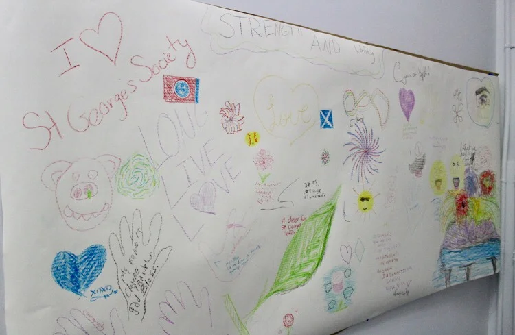 Mural decorated by students and beneficiaries