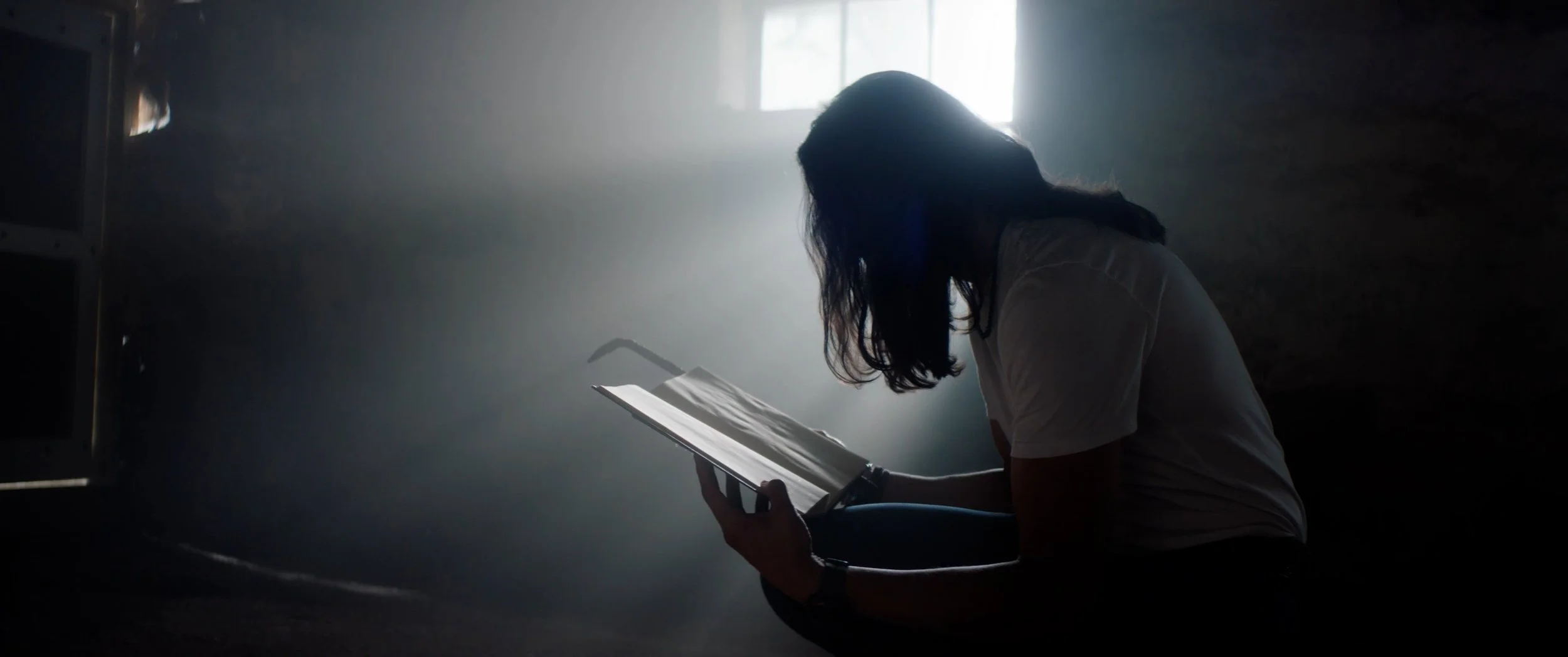 TOCH_Paden_book_backlit_Film_Still.jpg