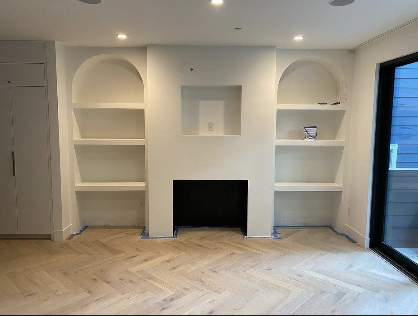 custom built shelving and fireplace surround