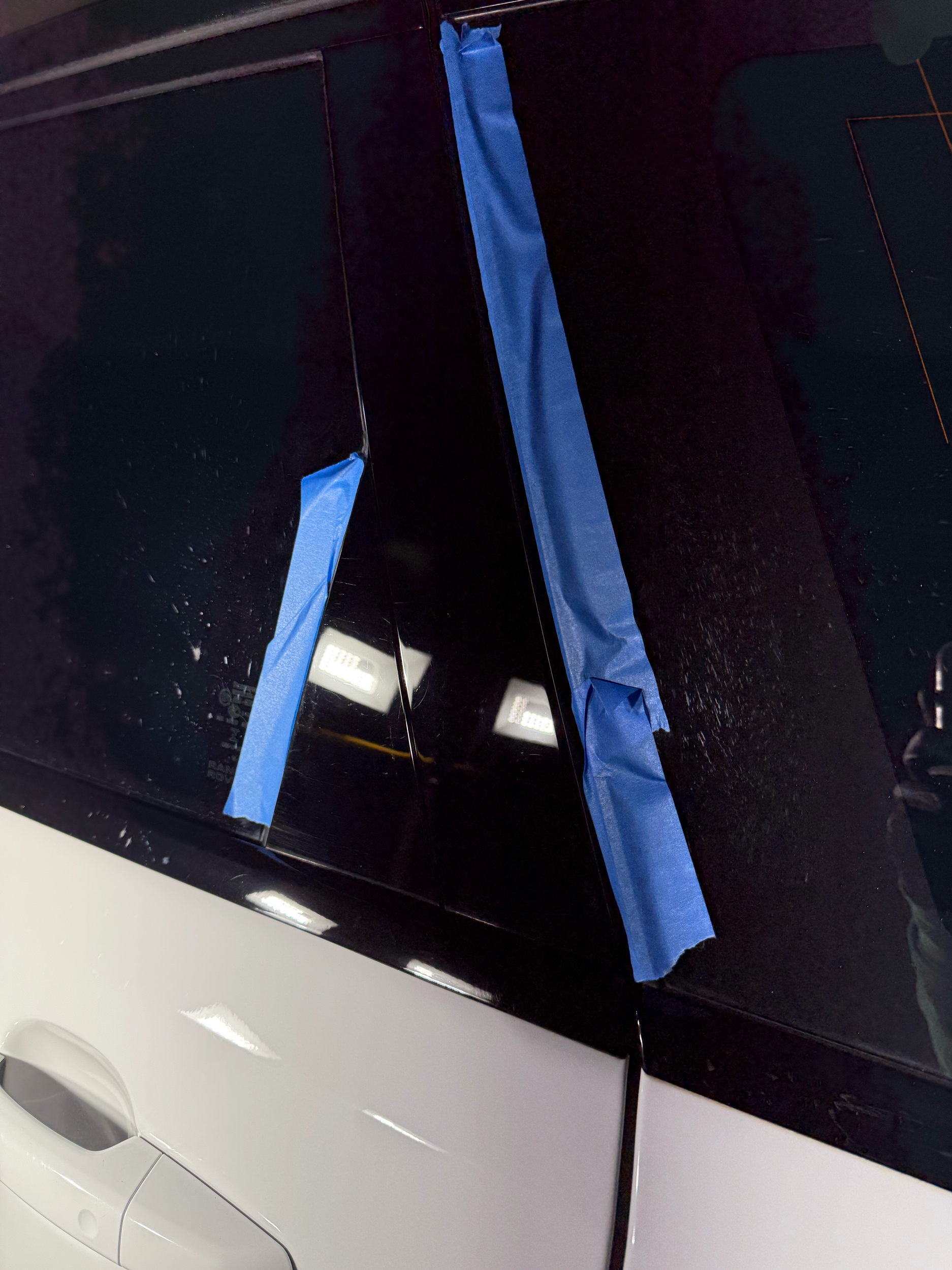 a deep gloss black car door frame after polishing