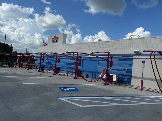 Oranssi technician working on a roof project
