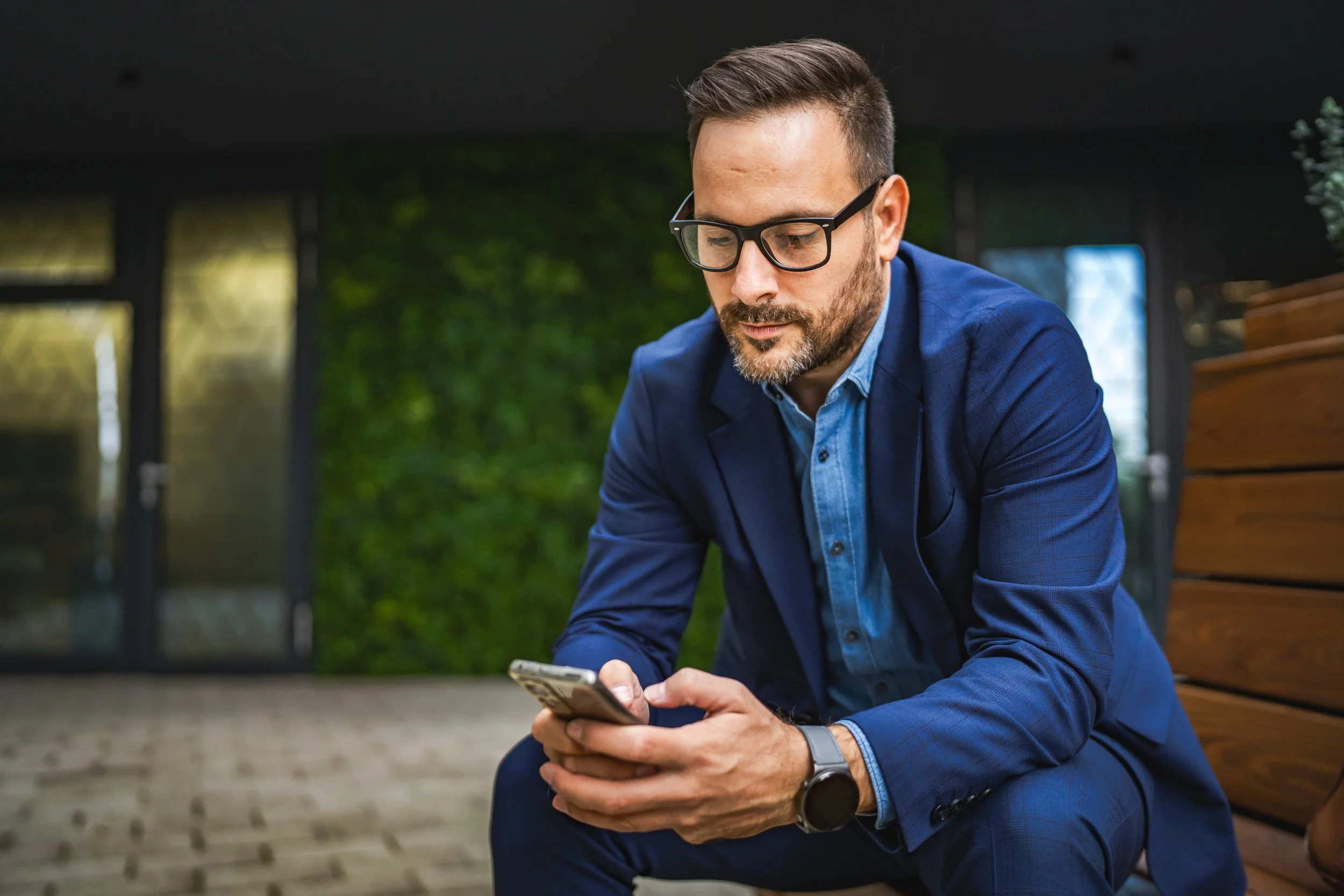 A distribution sales rep looking at product guidance on their phone before a customer meeting
