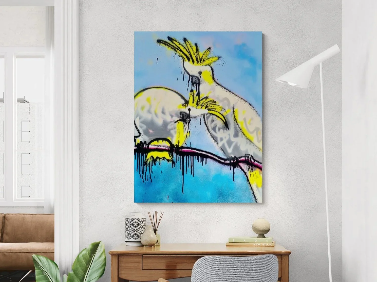 Contemporary abstract painting of two cockatoos on a branch with blue background painted with spray paints.