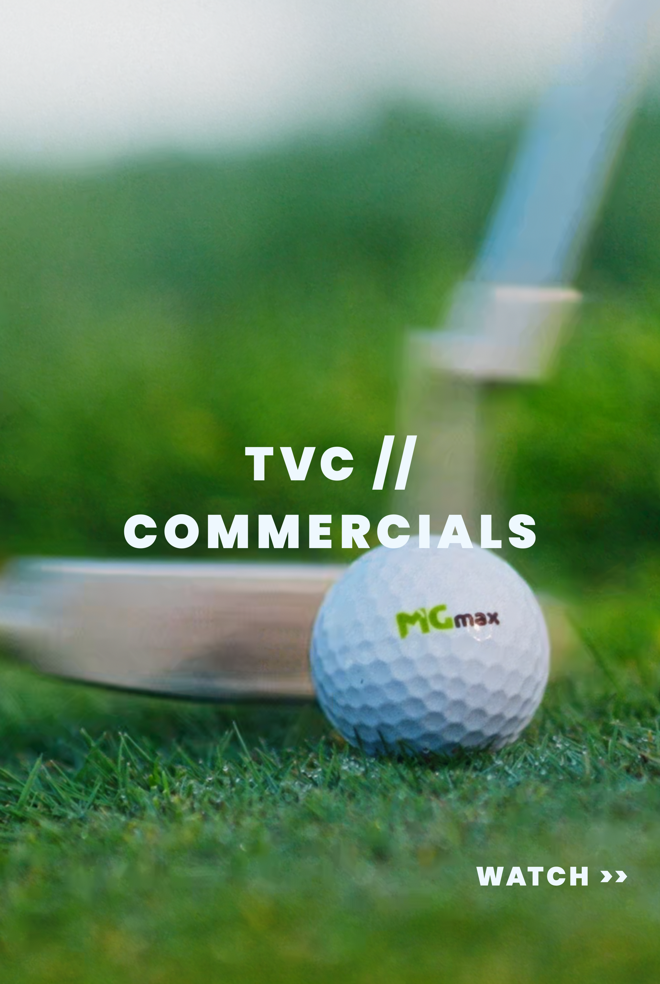 A close-up of a golf ball on grass with a golf club in the background, advertising TVC commercials for MG max, with a "Watch" button. Merlin TV ads and commercial playlist