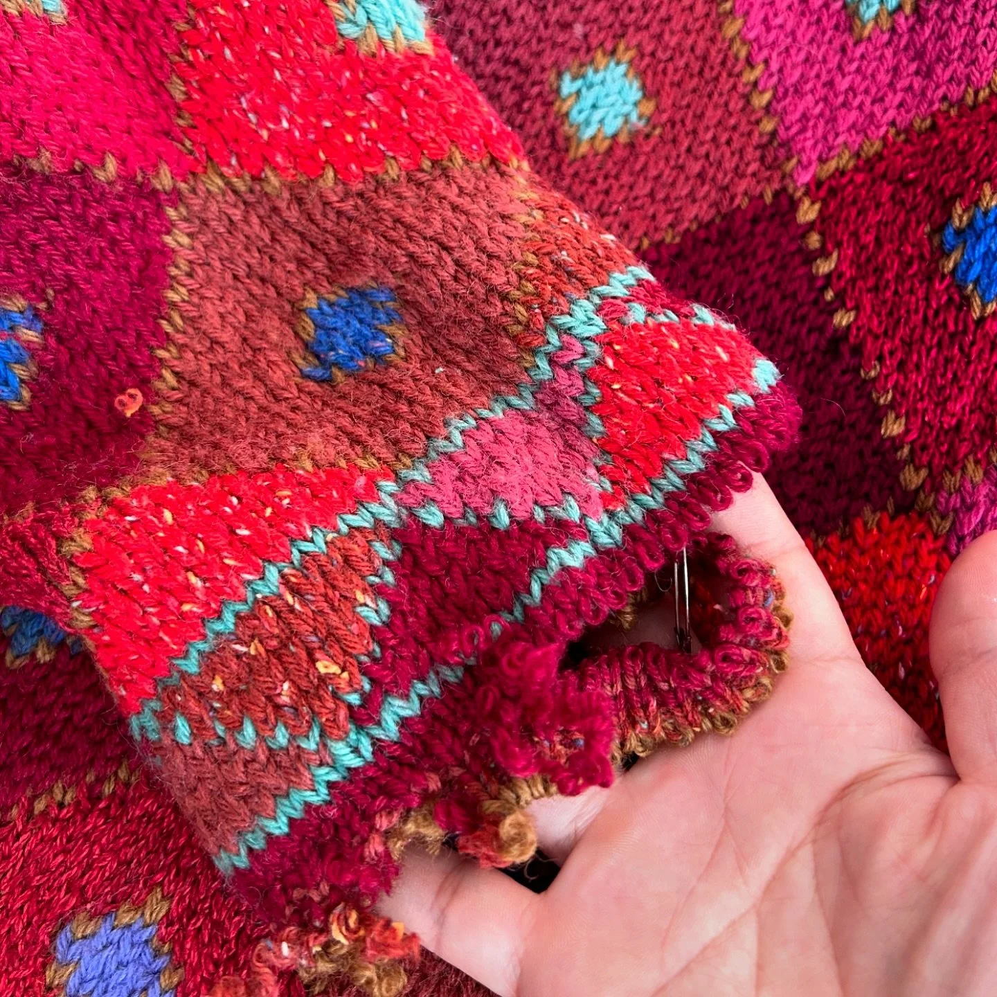 The before and after of a restoration. 
The beautiful heirloom jumper sustained some moth damages in the cuffs. As there was not enough yarn to invisible repair all the holes, we reduced the cuffs to a shorter length, and finished it with a clean edg