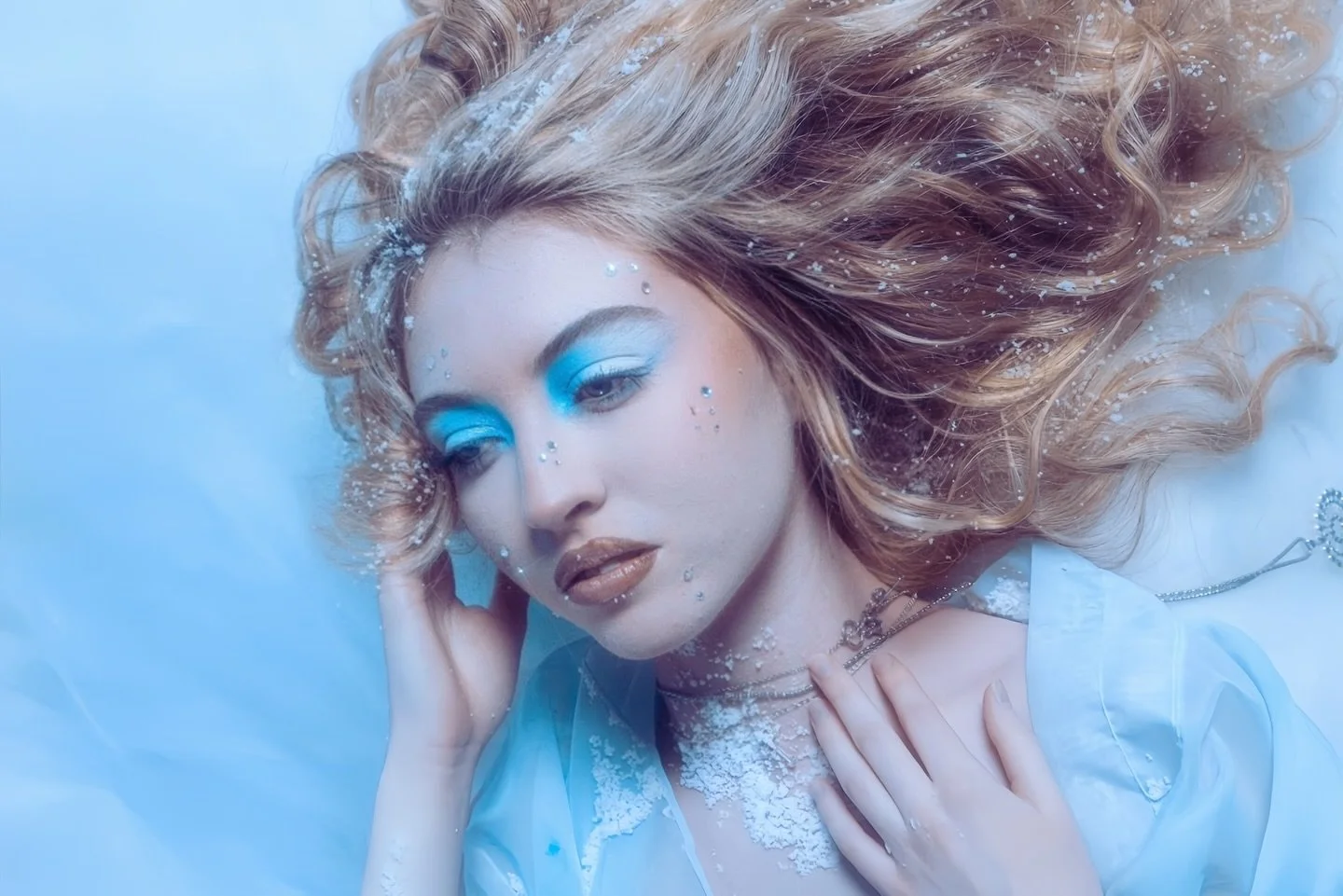 But in her frost, a longing softly sleeps,
A hidden thaw, where warmth its vigil keeps.

A whispered wish for sun to touch her brow,
And break the chains of ice that bind her now.

For even in this kingdom, stark and grand,
A frozen heart still dream