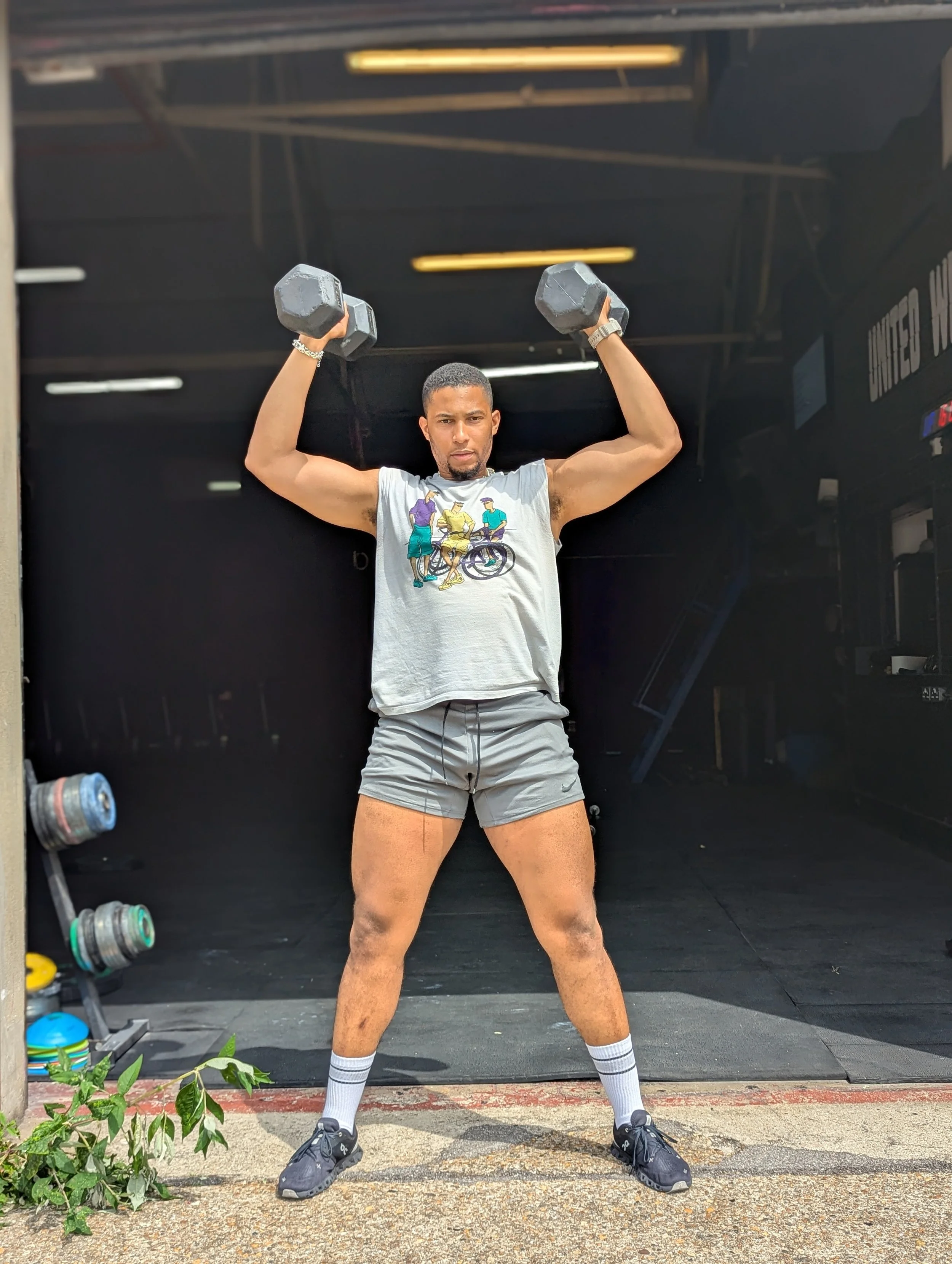 Crossfit weightlifter arms by head.jpg