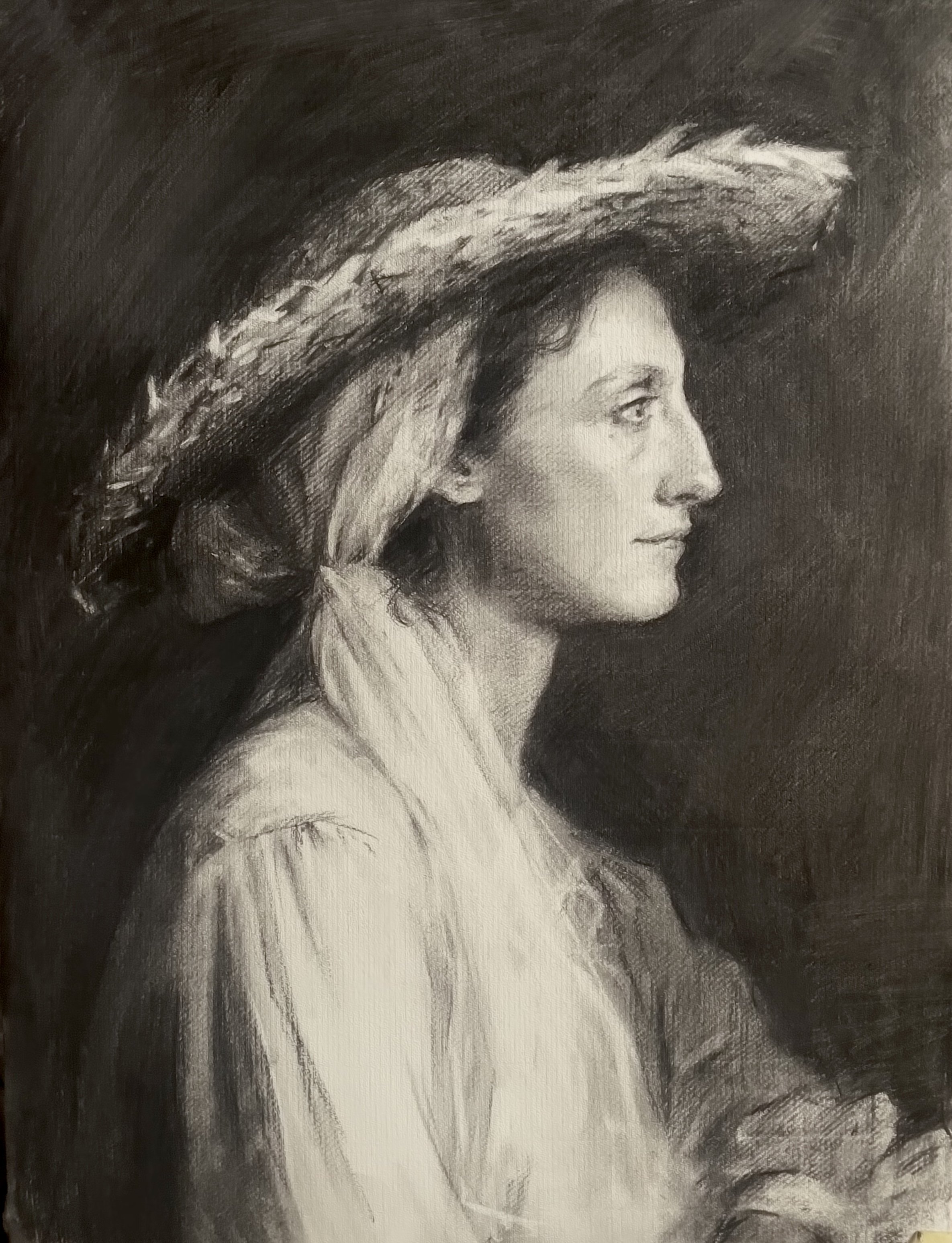 Isanna in hand-woven rush hat, charcoal on paper, 2026