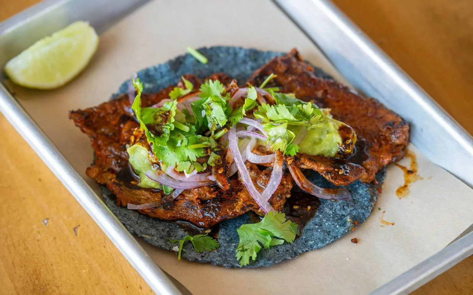  Ribeye Asada, Guacamole, Salsa Macha, Red Onions, Cilantro, Heirloom Blue Corn Tortilla 