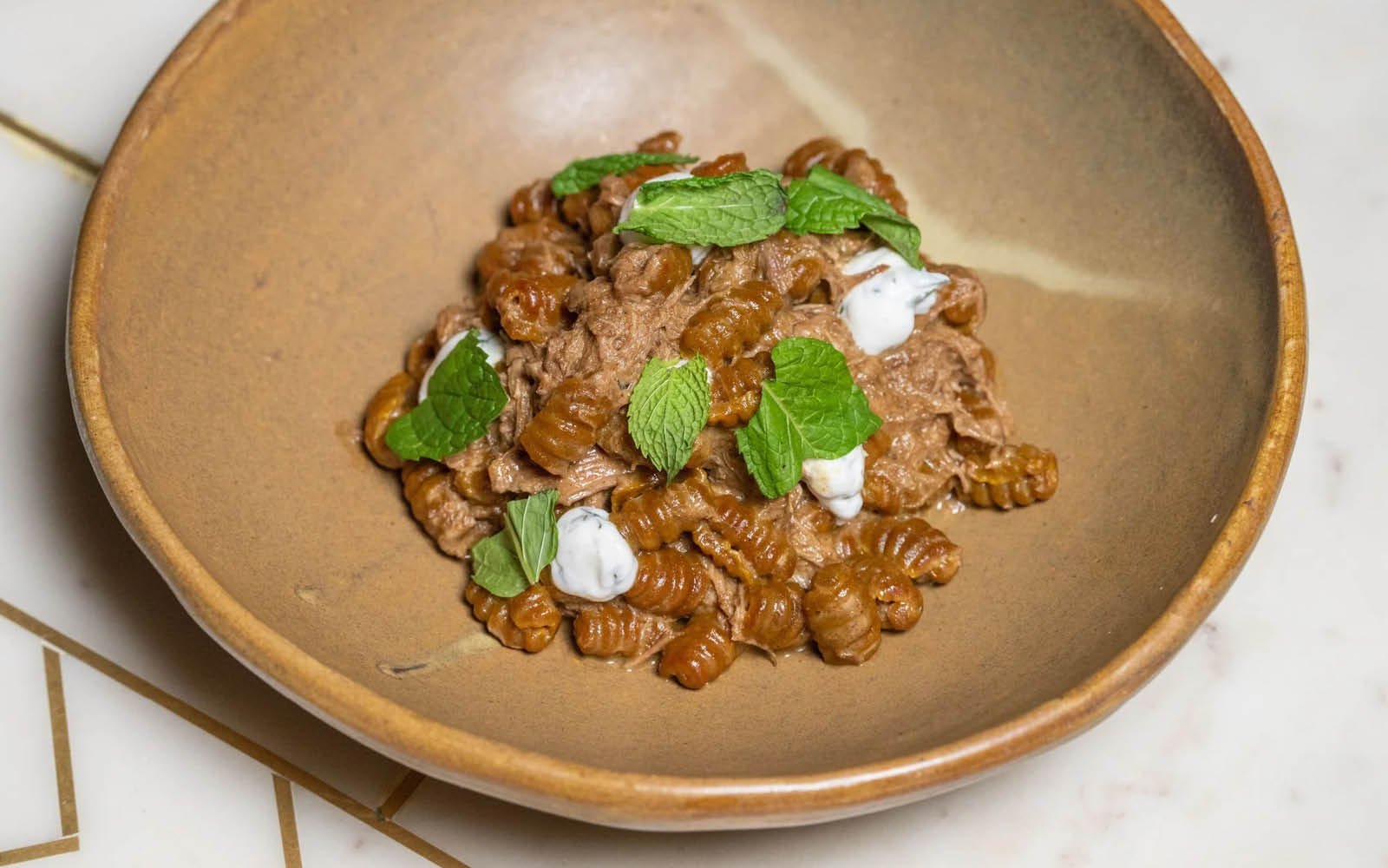  Sri Lankan Goat Curry Malloreddus, Mint Yogurt, Breadcrumbs, Mint 