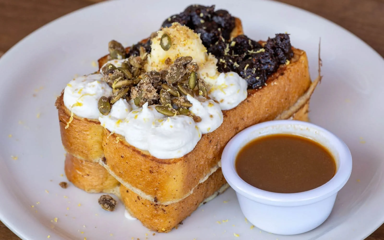  Fig and Honey French Toast: Texas Toast, Fig Jam, Honey-Lemon Ricotta, Candied Pepitas, Honey Butter, Steen’s Cane Syrup, Lemon Zest 