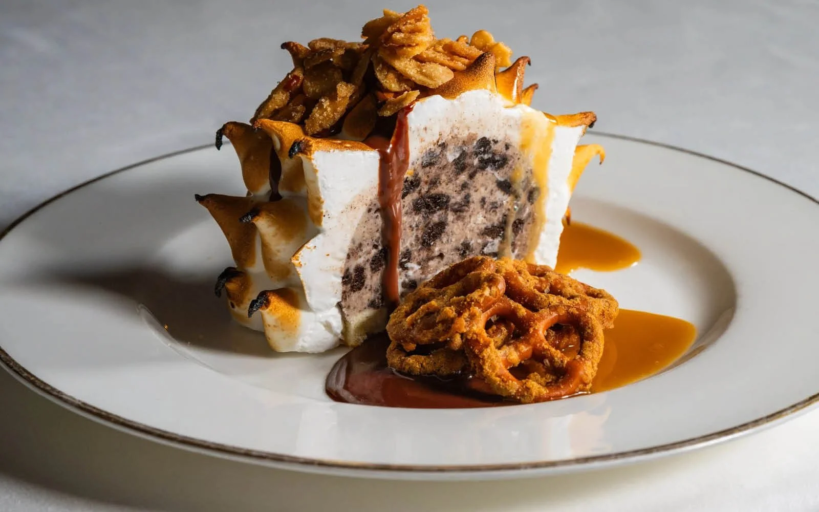  Baked Alaska: Cookies and Cream Gelato, Vanilla-Chocolate Chiffon Cake, Butterscotch Sauce, Chocolate Sauce, Almond Brittle, Malted Pretzels 