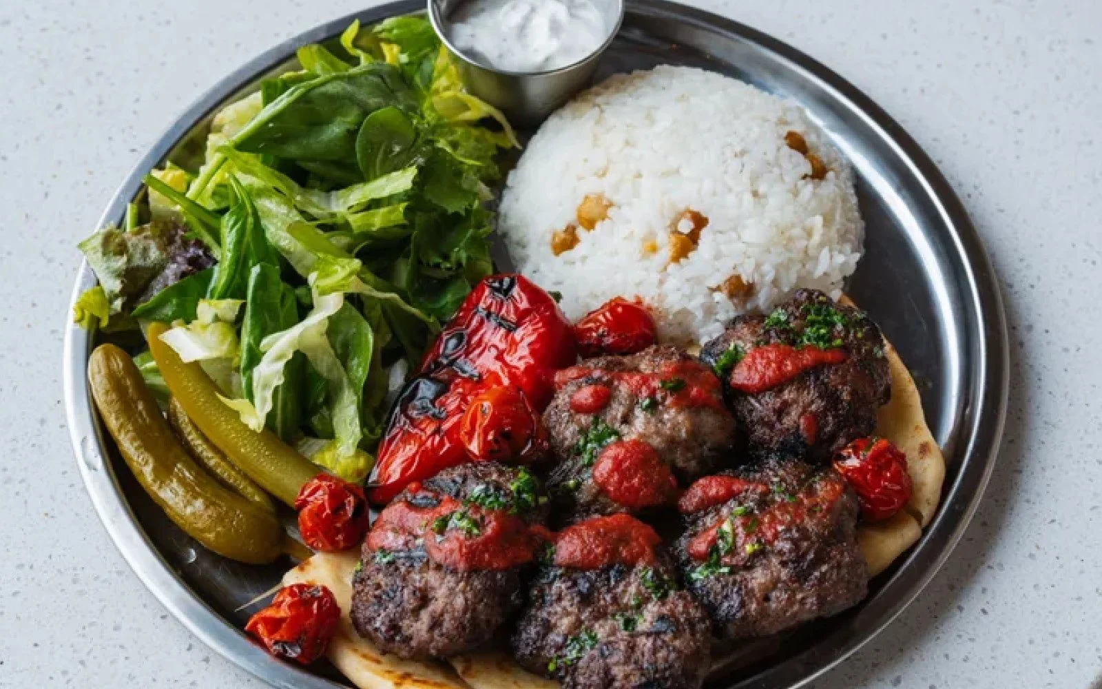  Kebab Beef Meatballs, Roasted Rice, Roasted Chickpeas, Grilled Peppers, Greens, Tomatoes, Cacik, Pita 