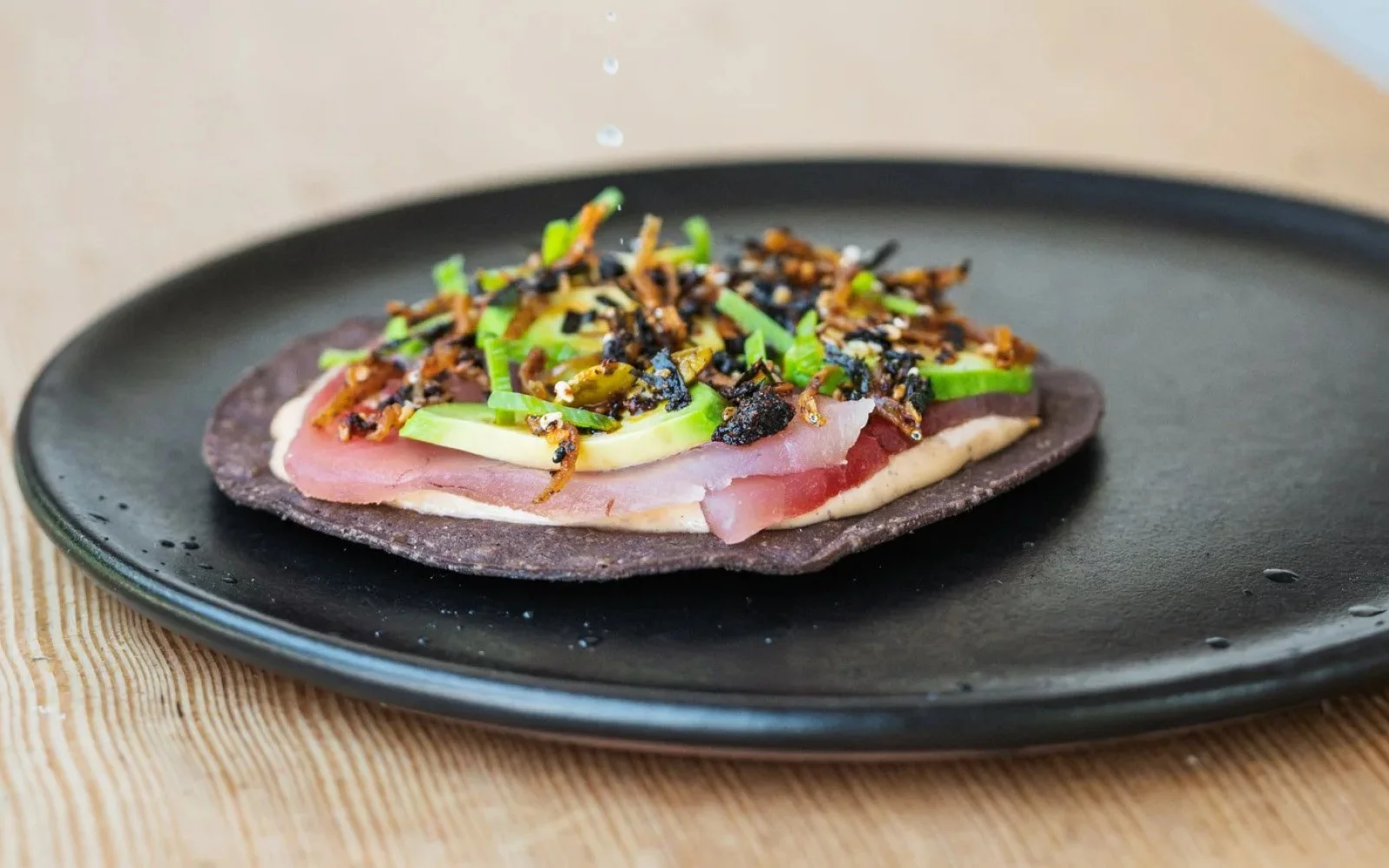  Albacore Tuna Tostada, Avocado, Pasilla Mixe Mayonnaise, Anchovy-Seaweed Salsa Macha, Scallions, Lime 