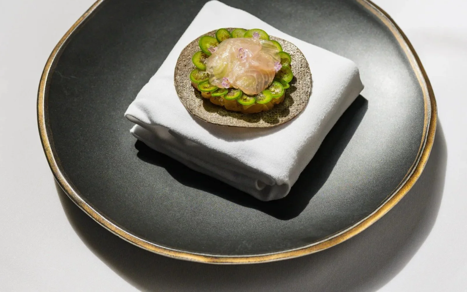  Kombu-Cured Kampachi, Avocado Mousse, Serrano Peppers, Monterey Seaweed Powder, Shiso Flower, Azul Masa Tostada 