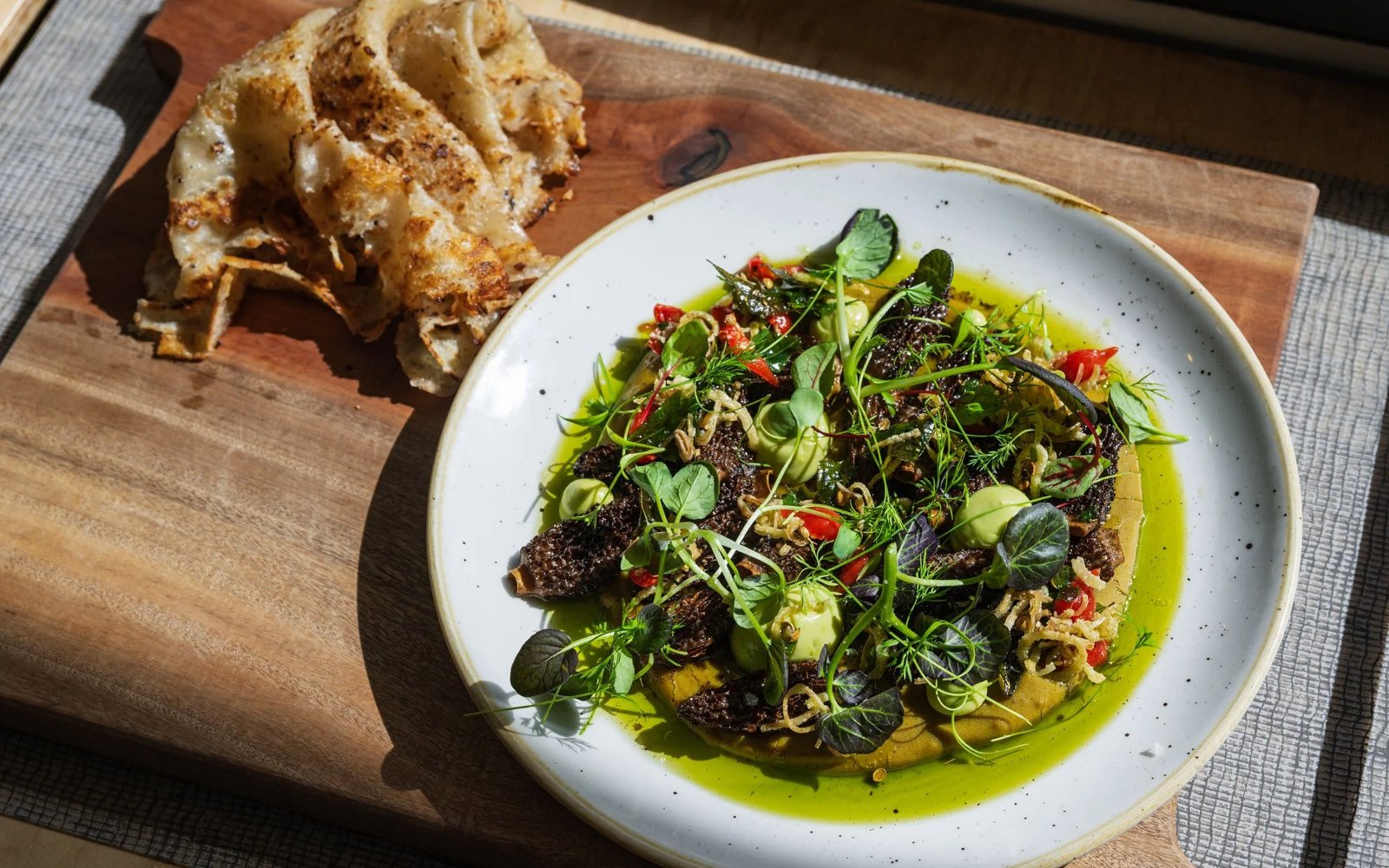  Brown Butter-Roasted Morels, Lentil Dal Purée, Avocado-Galangal Chutney, Curry Leaf-Fried Shallot Condiment, Sweet Peppers, Lime Juice, Fried Shallots, Mustard Seeds, Microgreens 