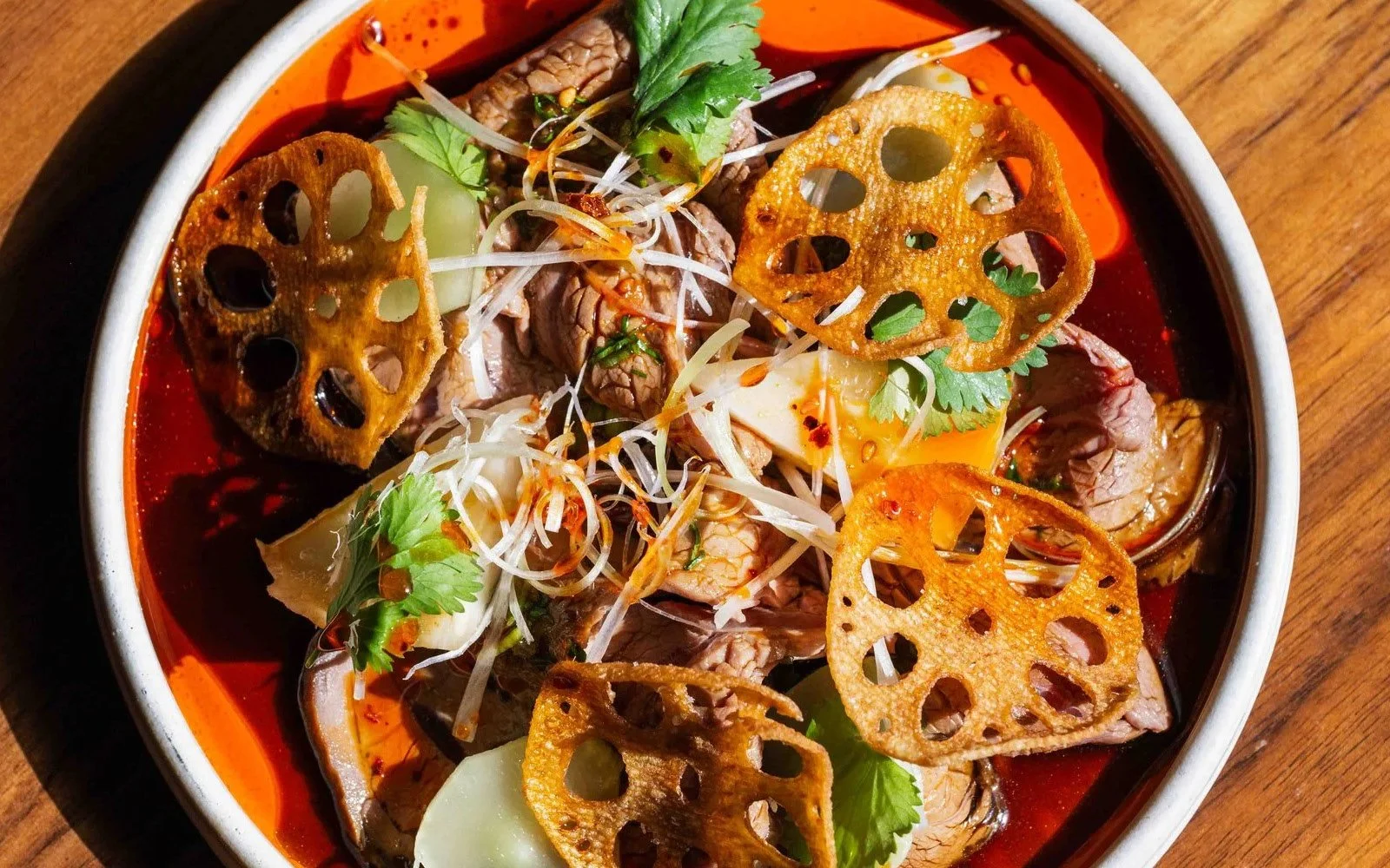 Master Stock-Braised Beef Shin, Confit Celery Root, Celtuce, Crispy Lotus Root, Beef Stock Vinaigrette, Sichuan Red Oil, Scallions, Parsley 
