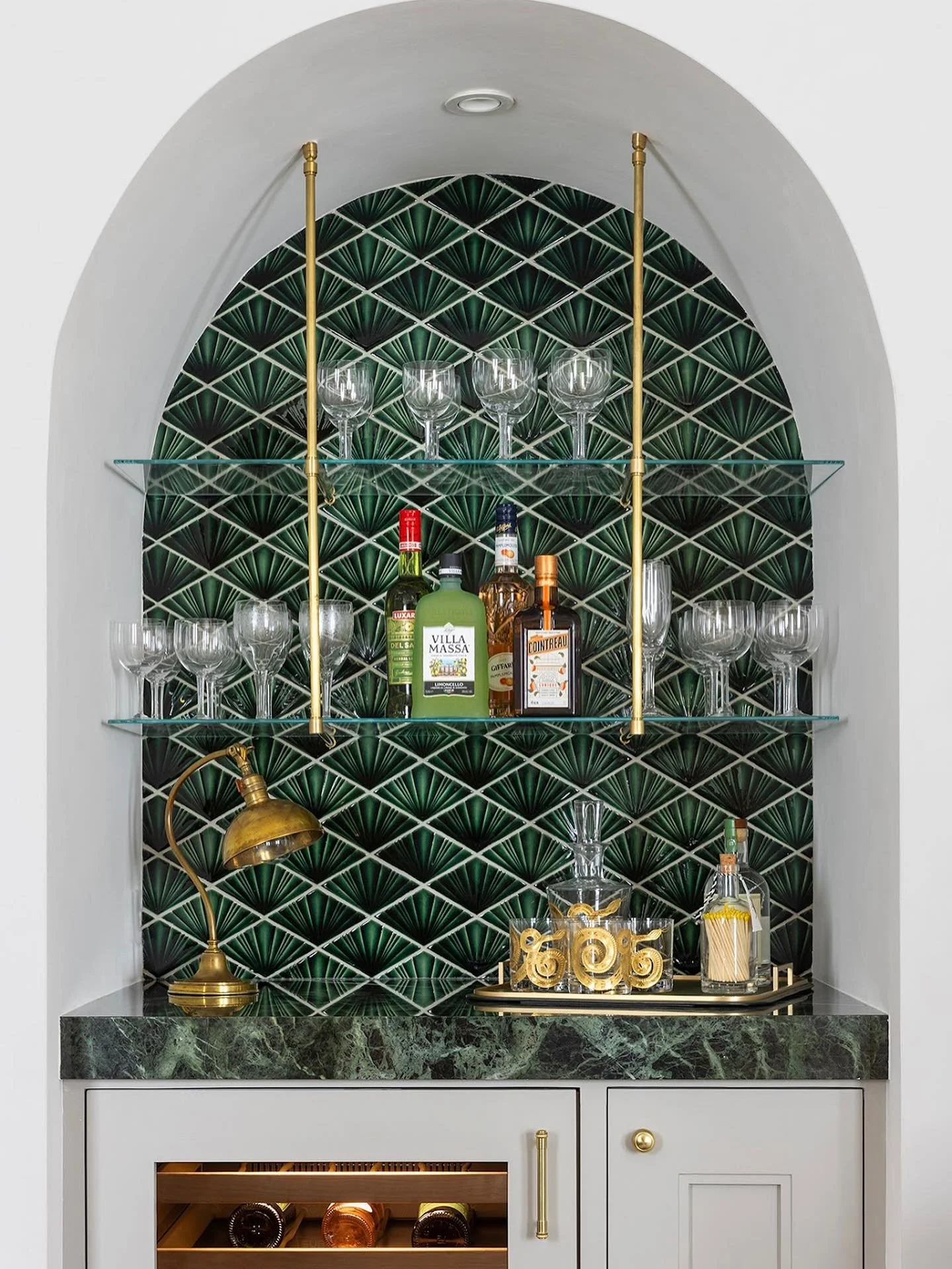 An elegant built-in bar designed for our client&rsquo;s Tudor-style Edwardian home in Pacific Heights. The emerald-green, Art Deco&ndash;inspired tile from @davincimarble creates a striking backdrop, complemented by @foundbymaja&rsquo;s exquisite bar