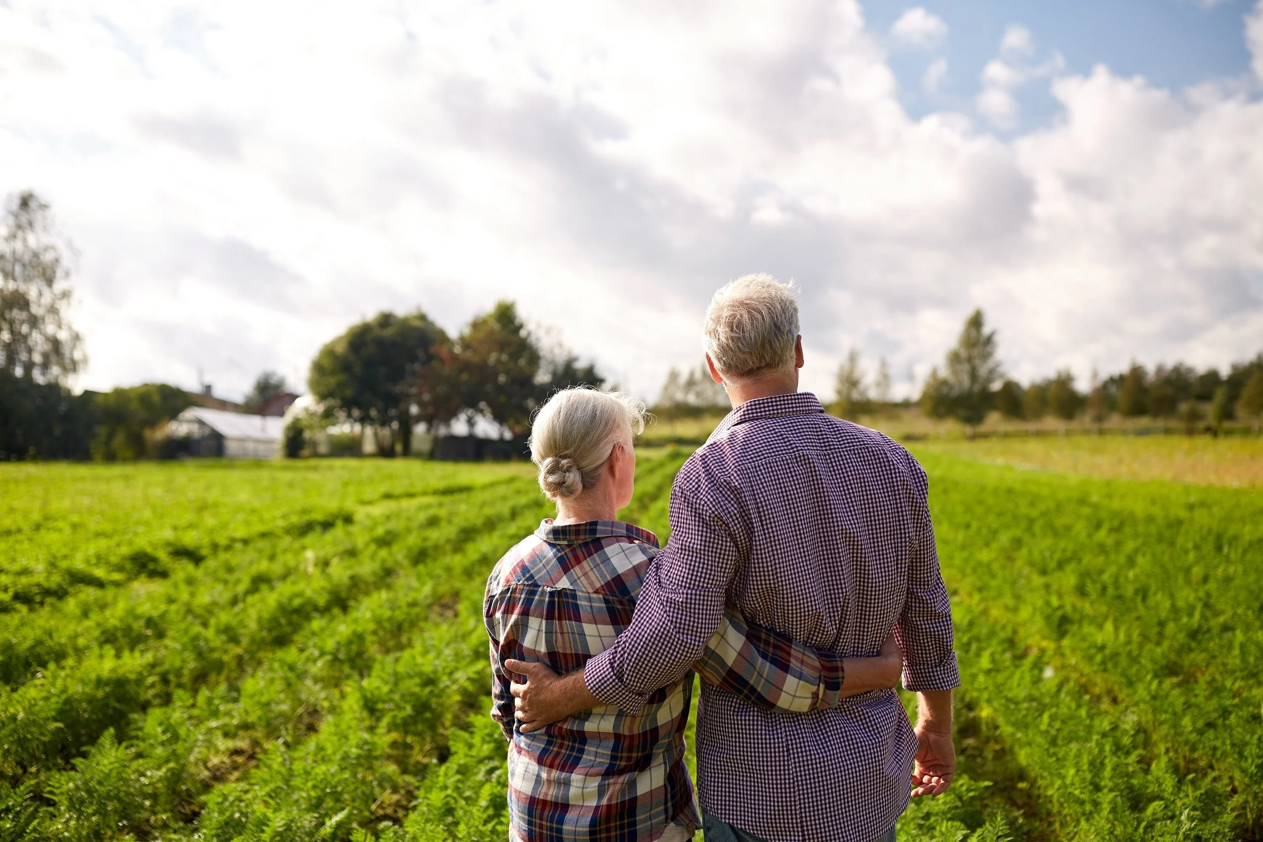 happy senior couple at summer farm.jpeg