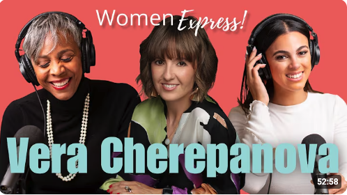 Smiling woman with short gray hair, wearing large headphones and a pearl necklace, speaking into a microphone in a recording studio, with text "Women Express!" and "Hosted by Denise Harrington".