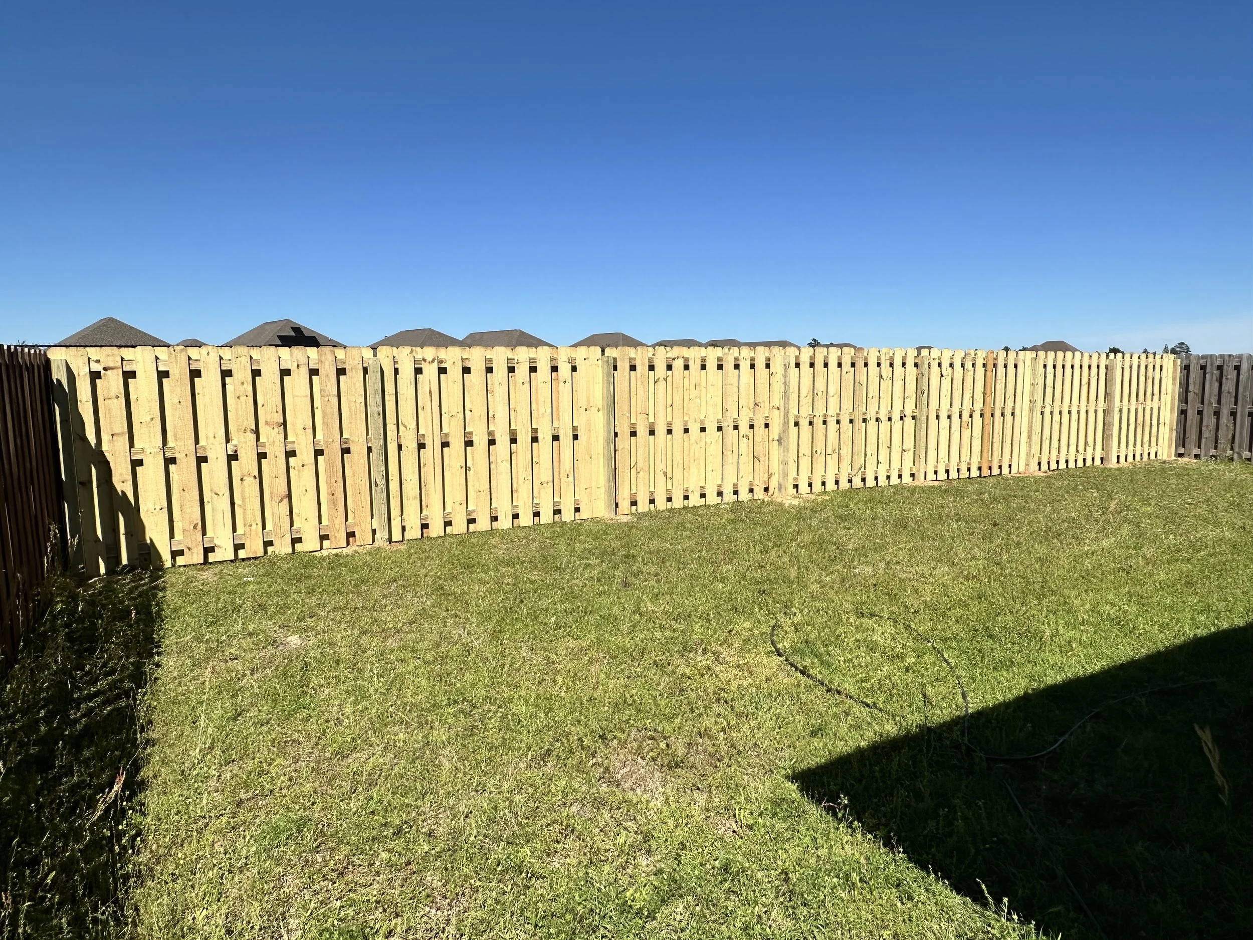 Shadowbox fence installed in Crestview FL providing privacy and airflow
