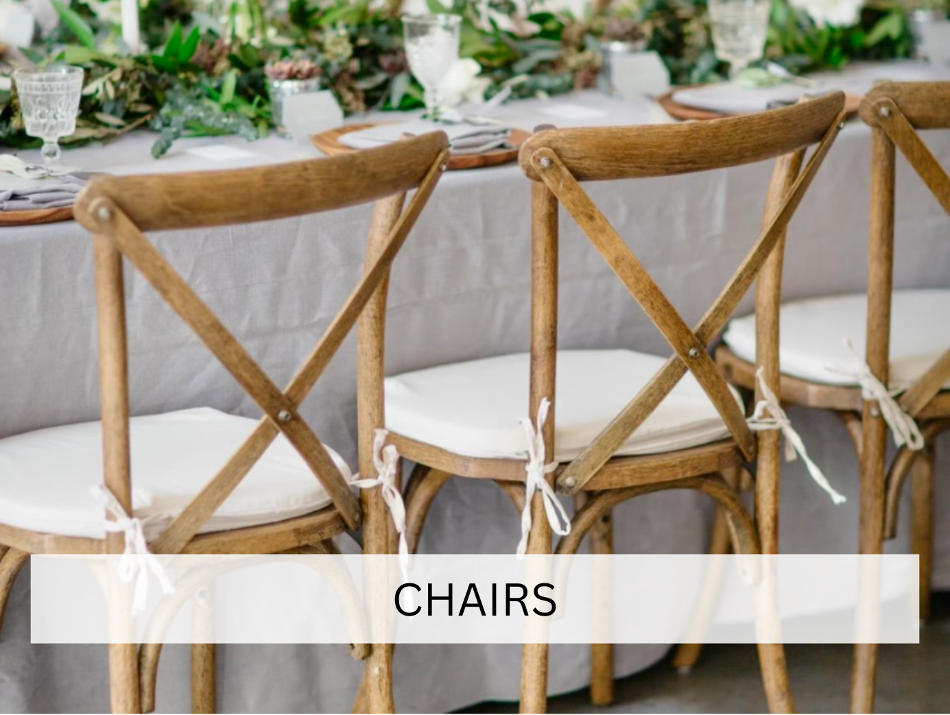 Rows of folding chairs set up on a grassy field, arranged for a large outdoor event or ceremony. The symmetry creates a structured and organized visual effect.