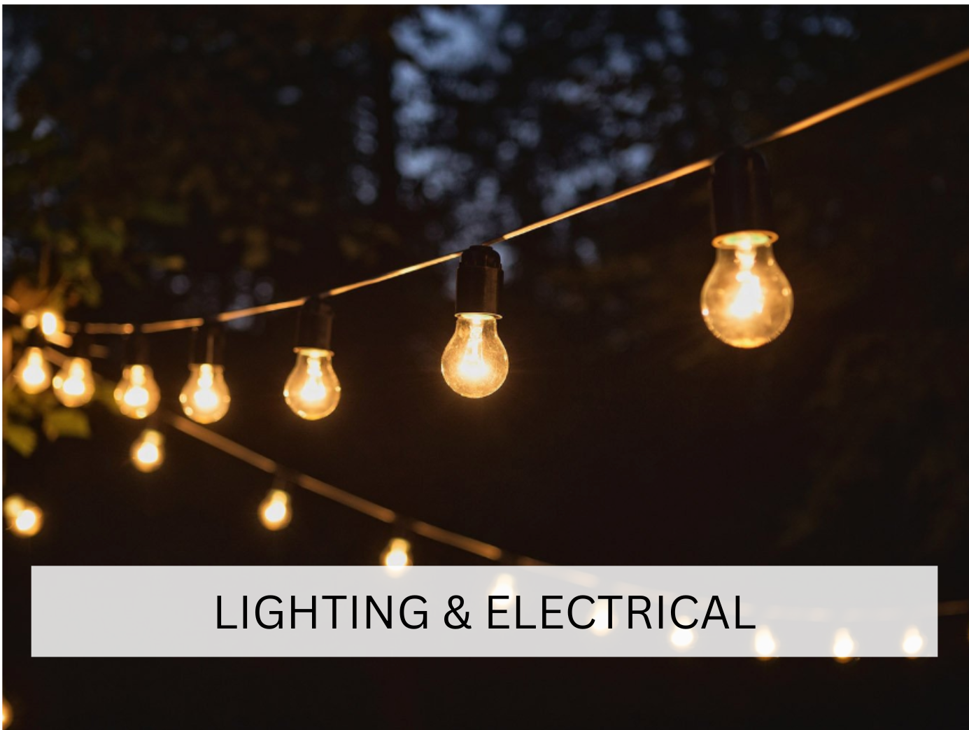 Outdoor string lights glowing warmly against the evening sky, creating an intimate and cozy ambiance for events or gatherings. The soft, hanging lights offer a festive and welcoming atmosphere.
