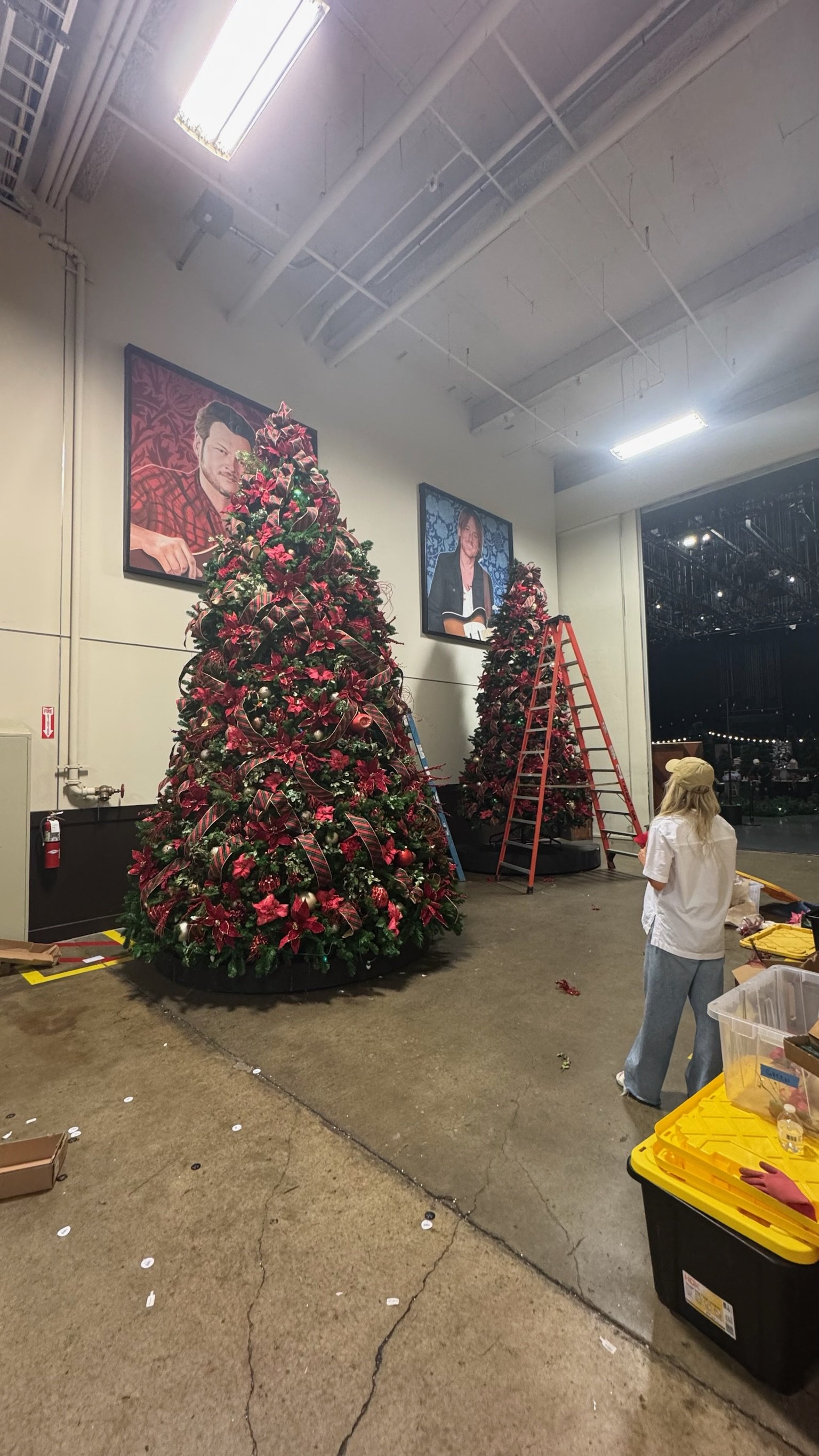 Large-scale Christmas tree installation and holiday set decorating for Hallmark television production by Whitney Elaine Interiors.